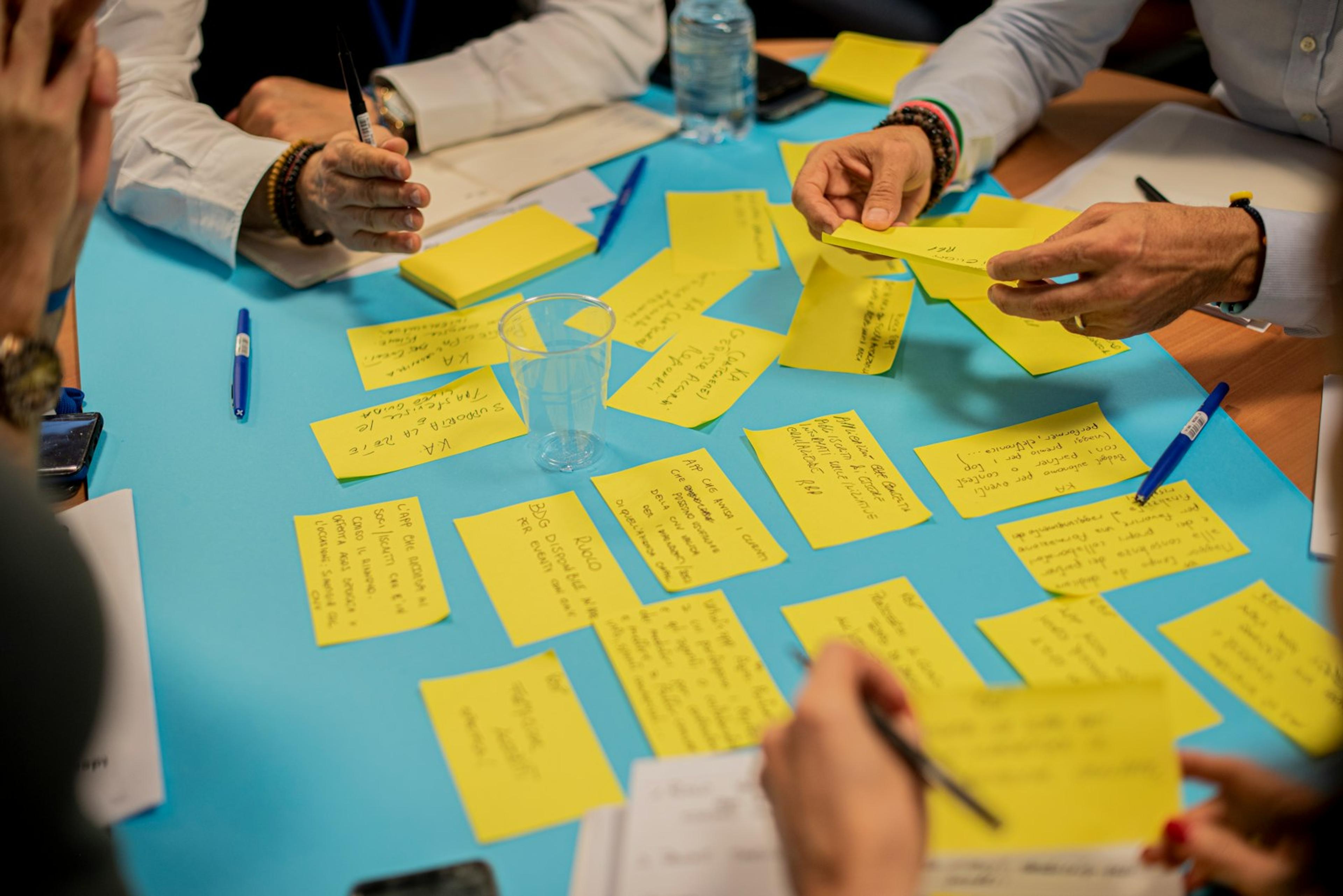 Colleague using sticky notes during a business continuity tabletop exercise