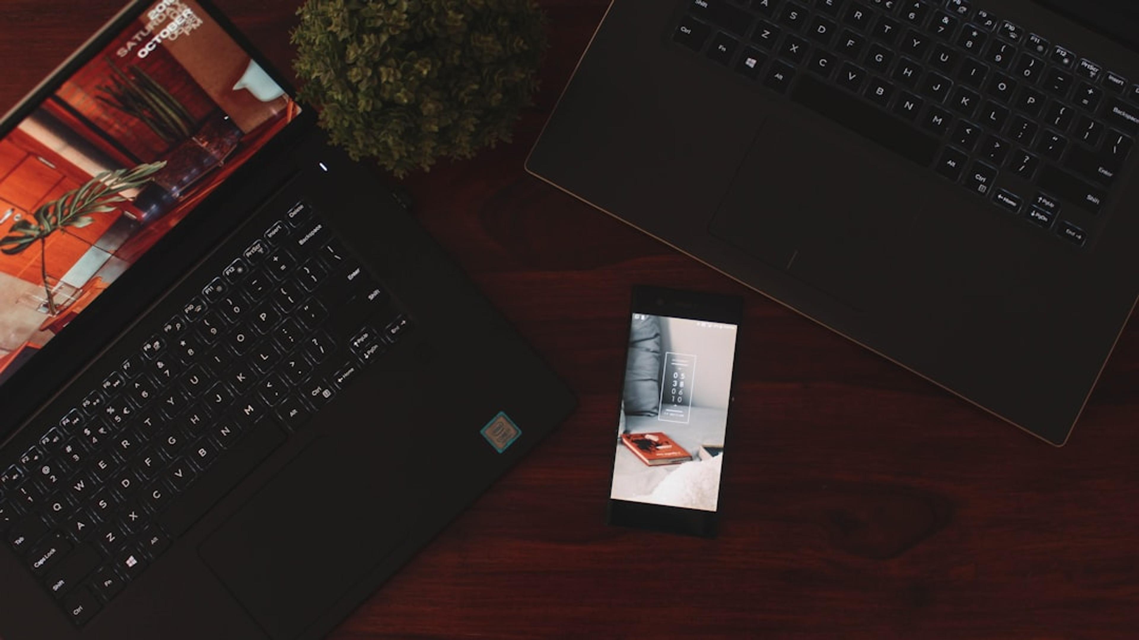 Laptop and smartphone used by mobile estate agents to manage calls and property enquiries