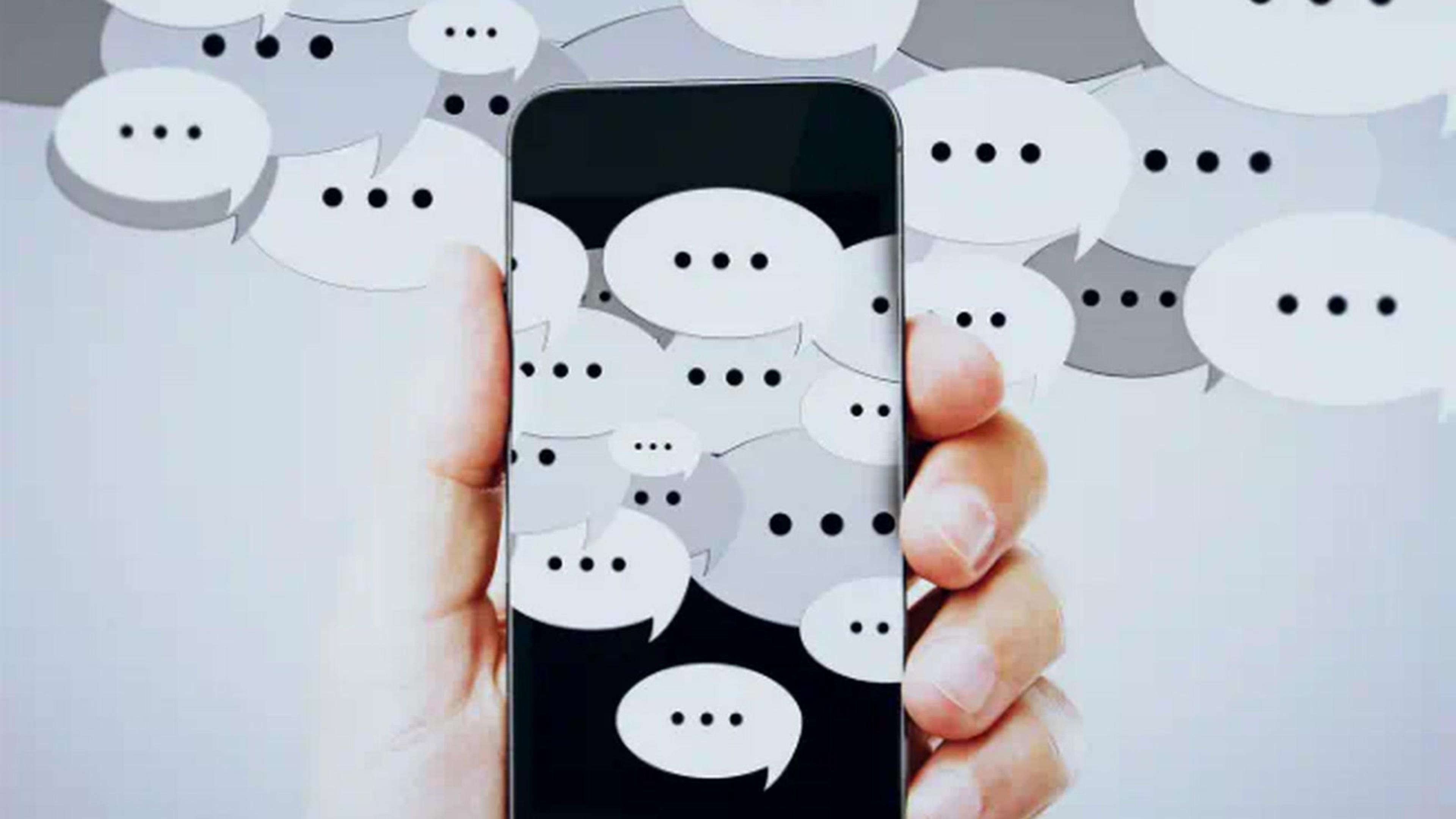 Phone in hand surrounded by chat bubbles — missed call text-back for small business