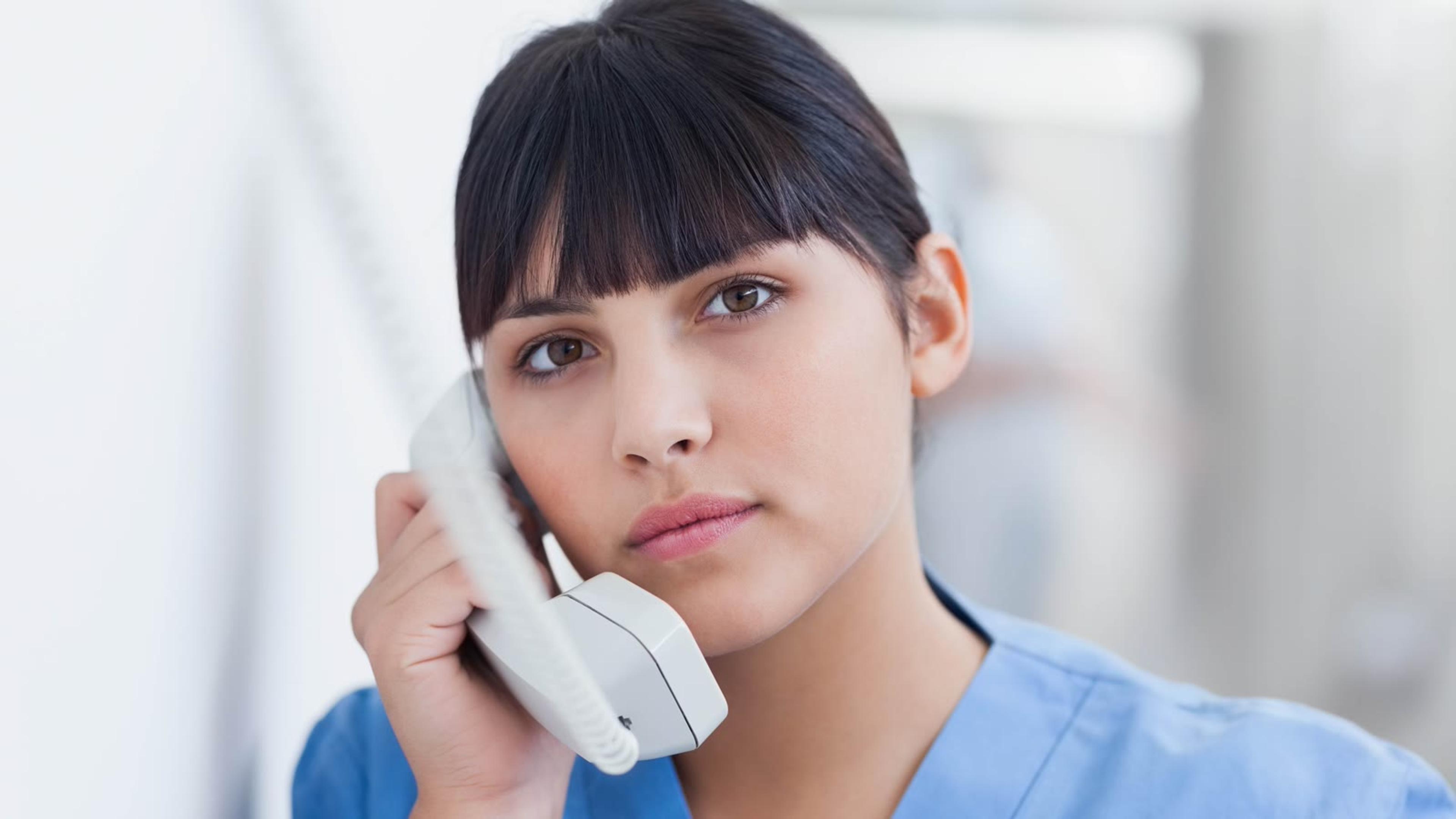 Medical professional talking on the phone in a hospital setting