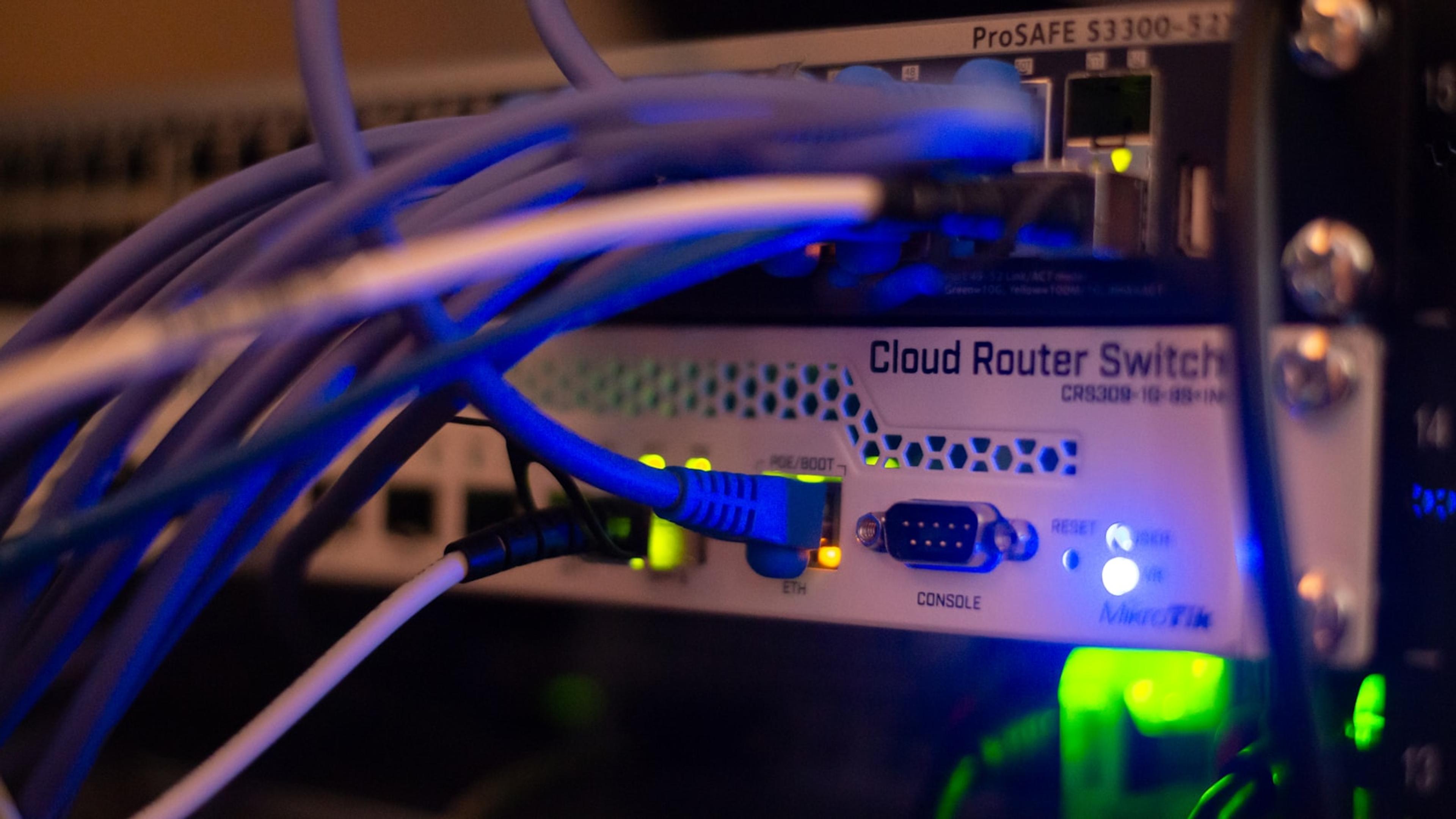 Ethernet cables connected to network equipment for VoIP traffic