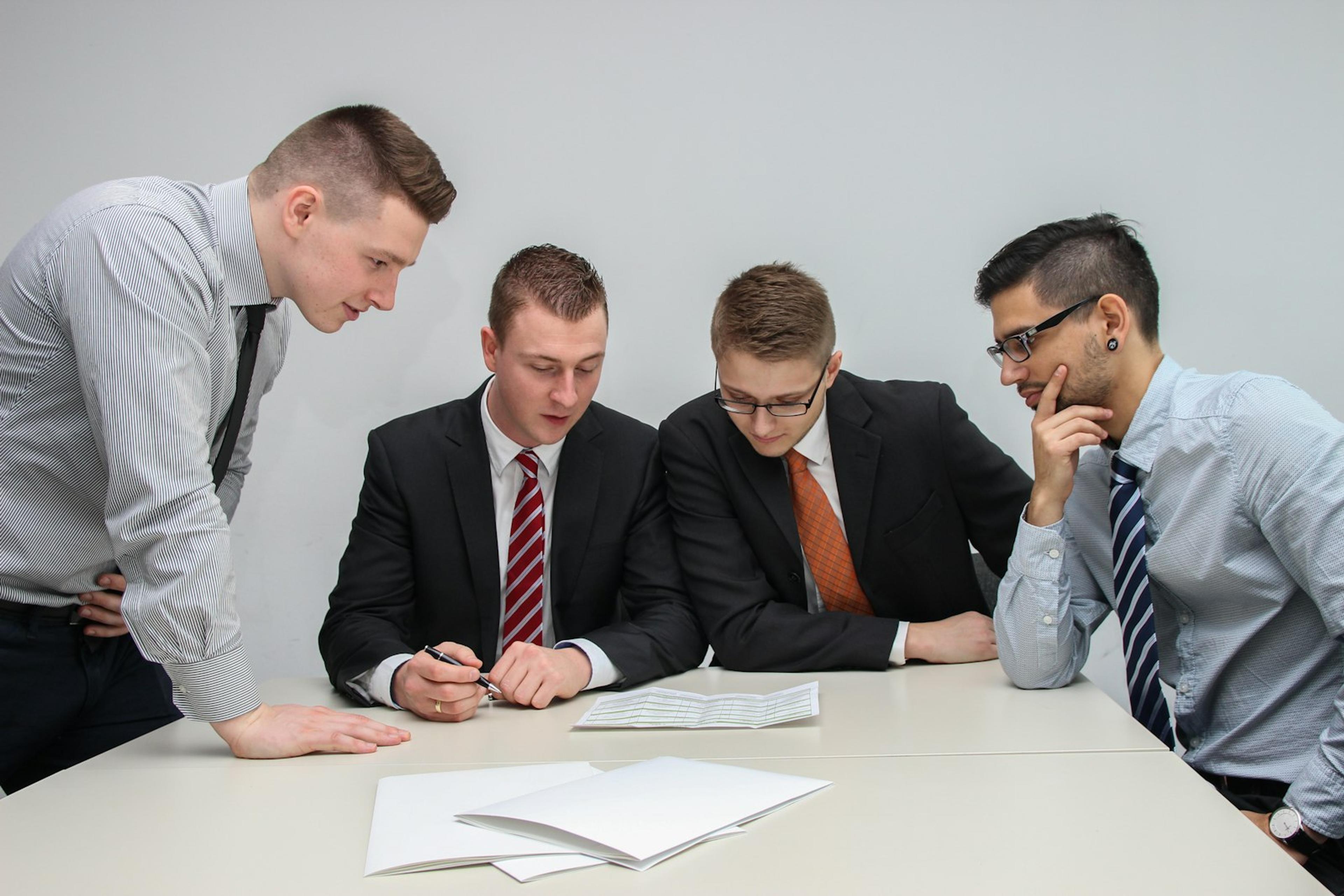 Business team reviewing documents around a meeting table