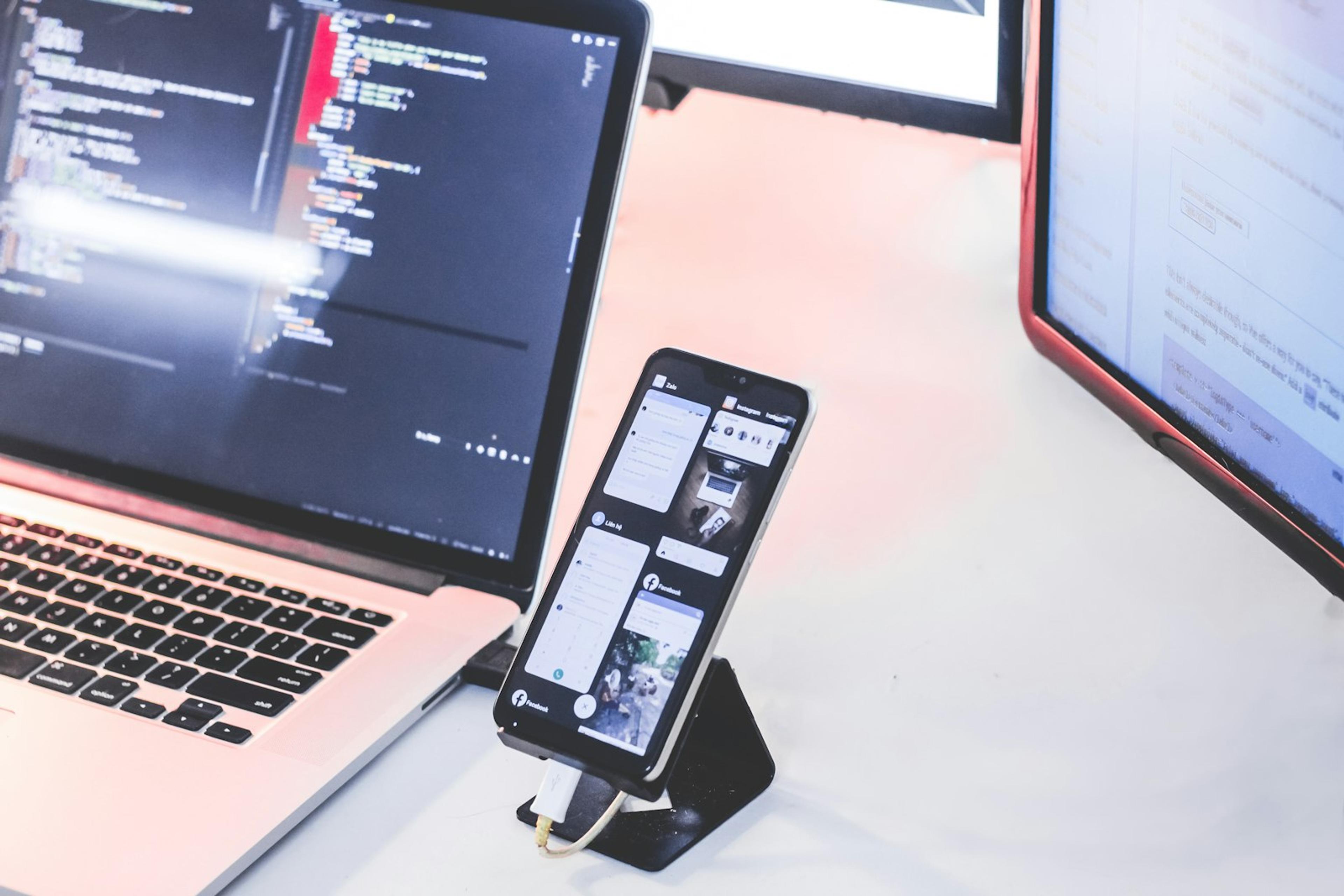 Smartphone and laptop prepared for desktop and mobile workflow testing