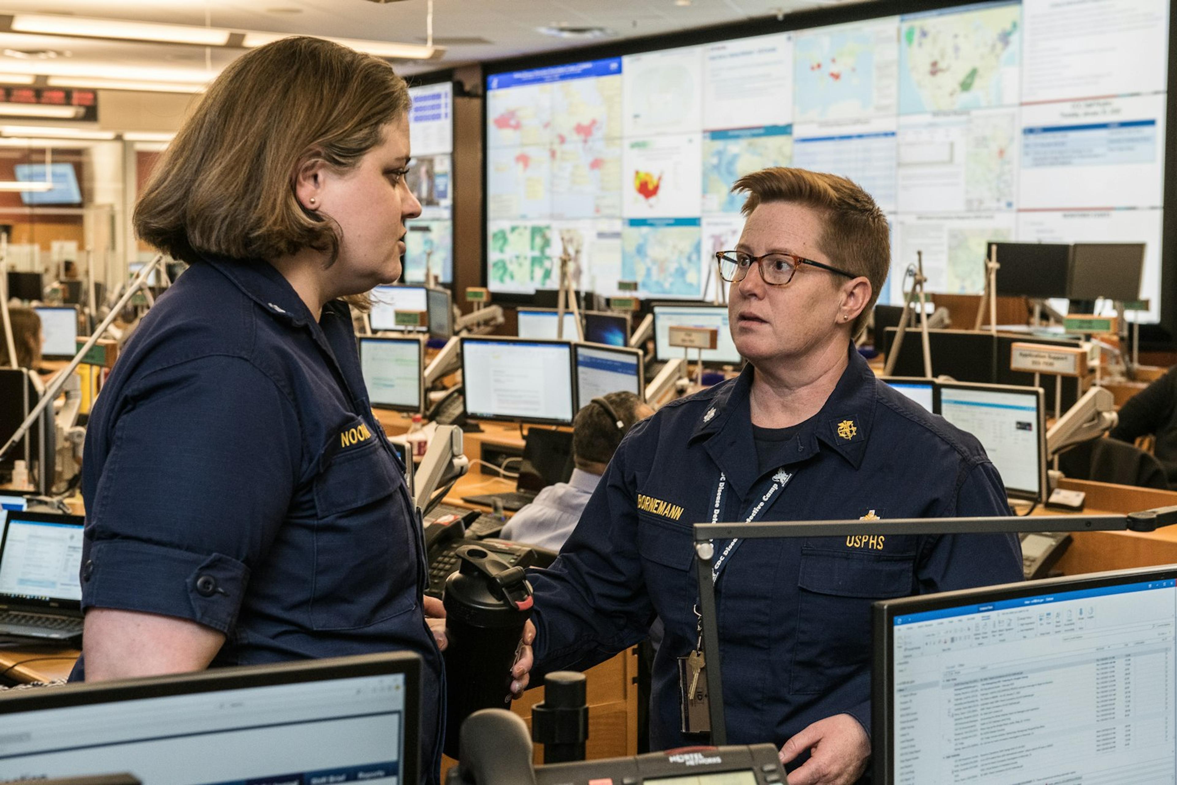 Customer service supervisor working at a computer in an operations centre