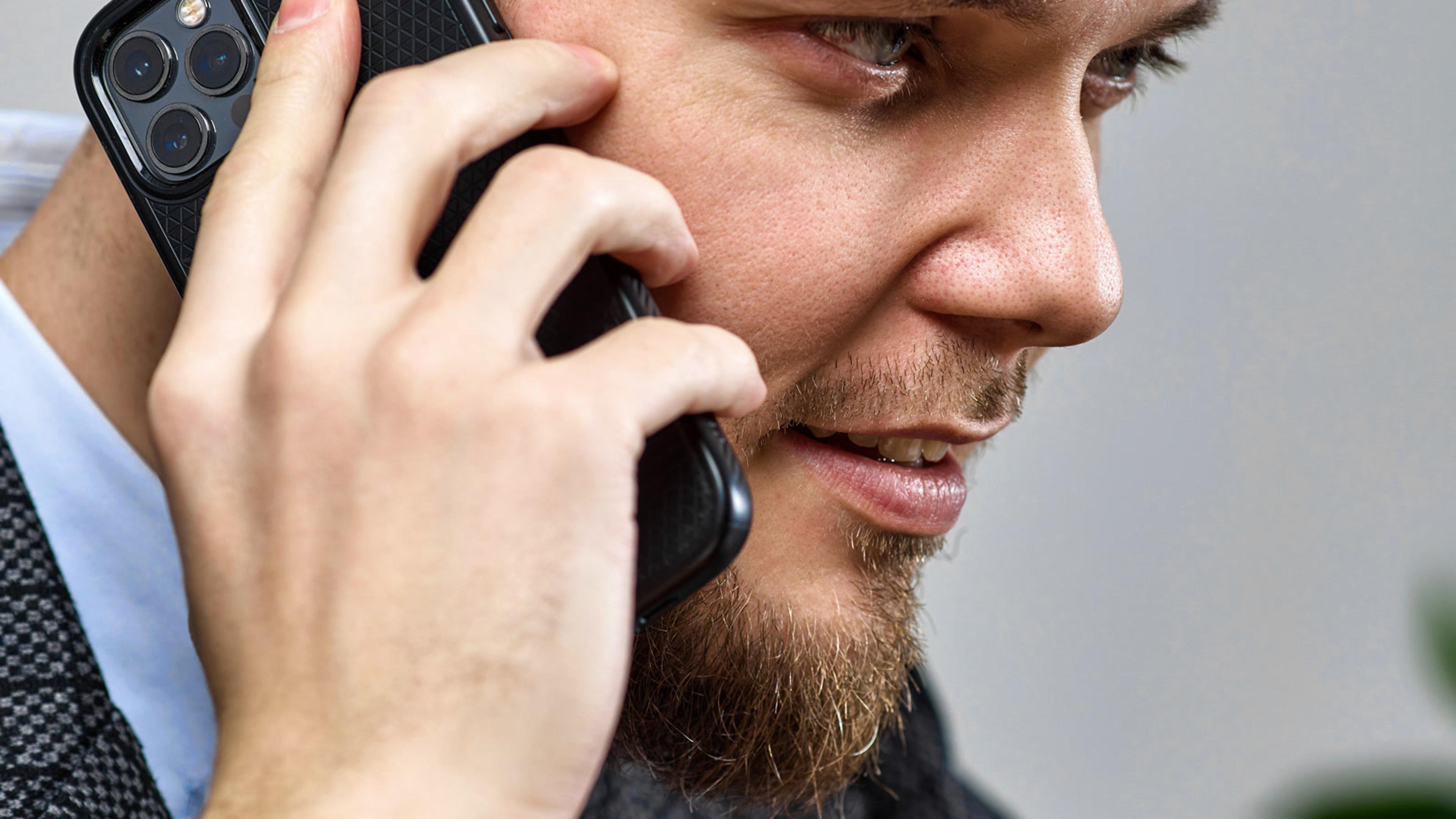 Man on a personal mobile phone for business calling