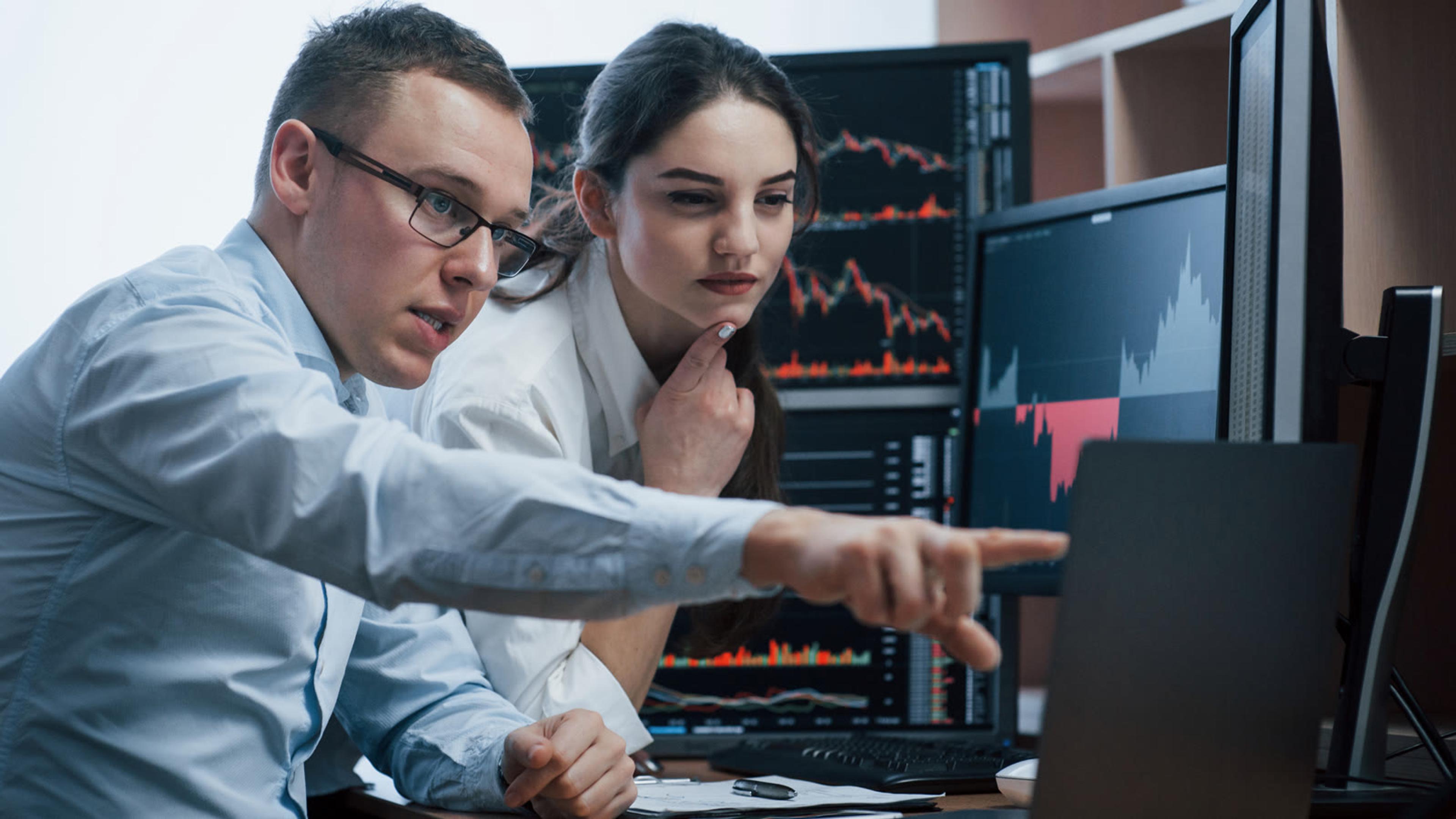 IT engineer and colleague reviewing a customer's setup on screen during hosted PBX onboarding