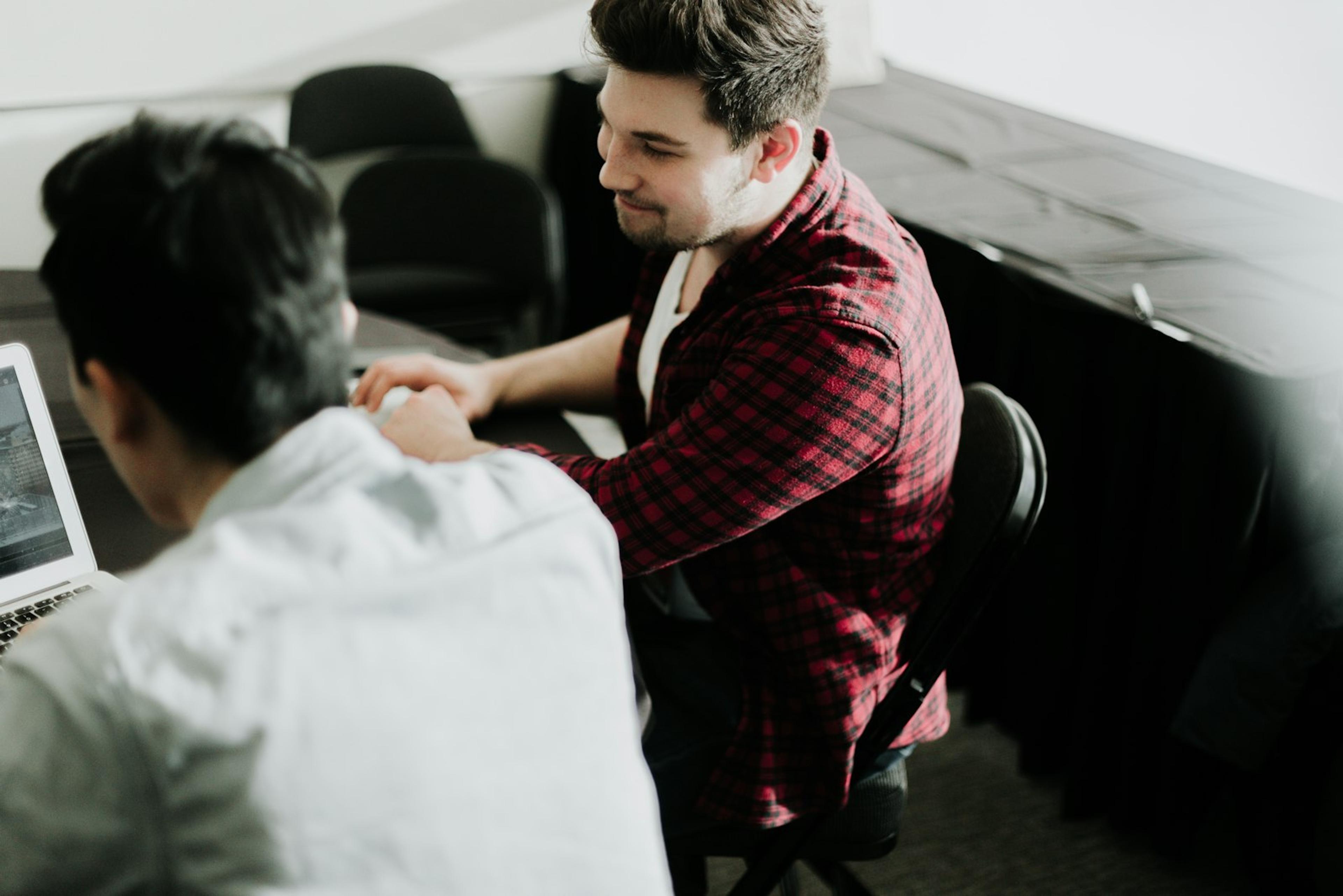 Business buyers agreeing terms after reviewing a technology proposal