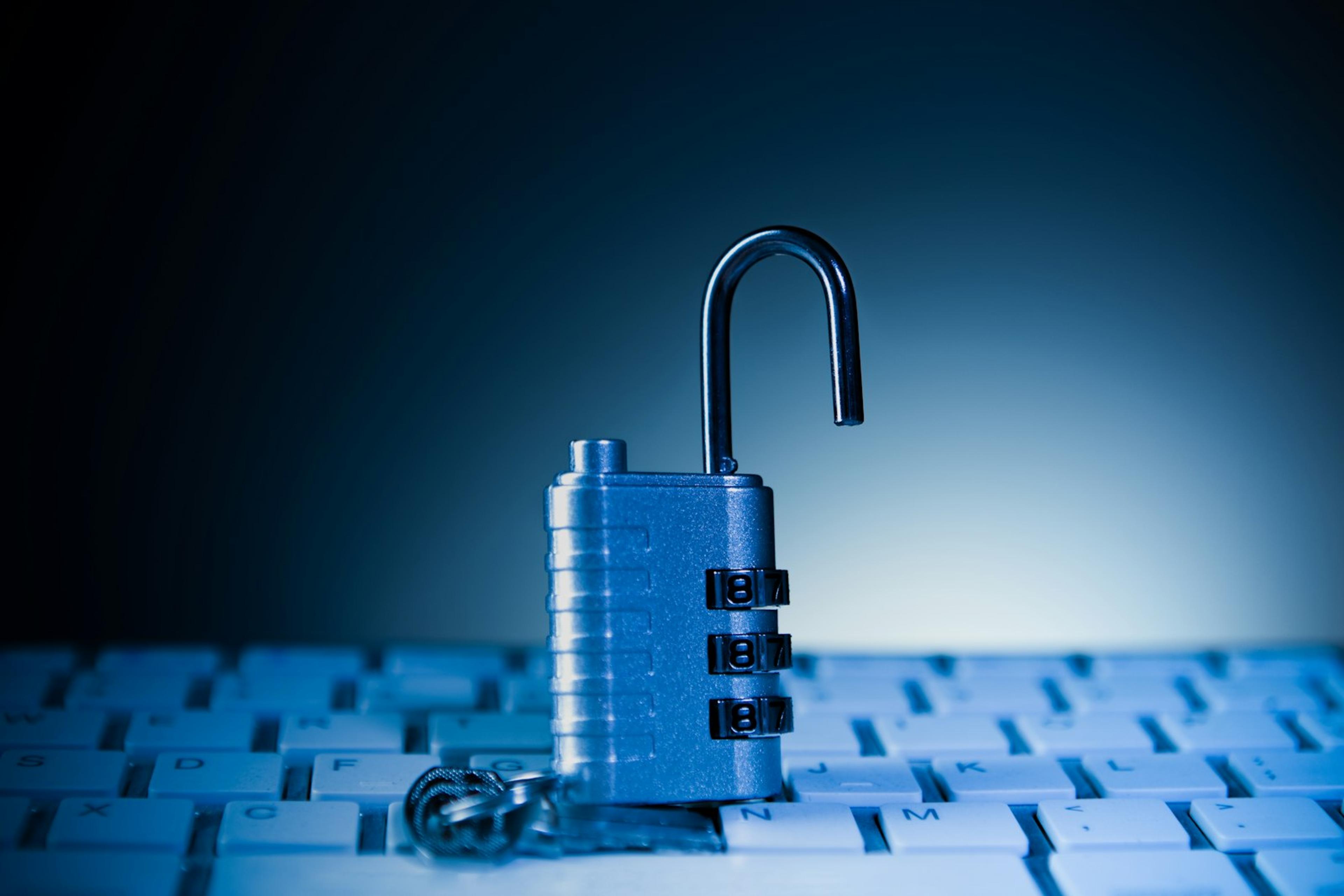 Open padlock on a computer keyboard representing endpoint security