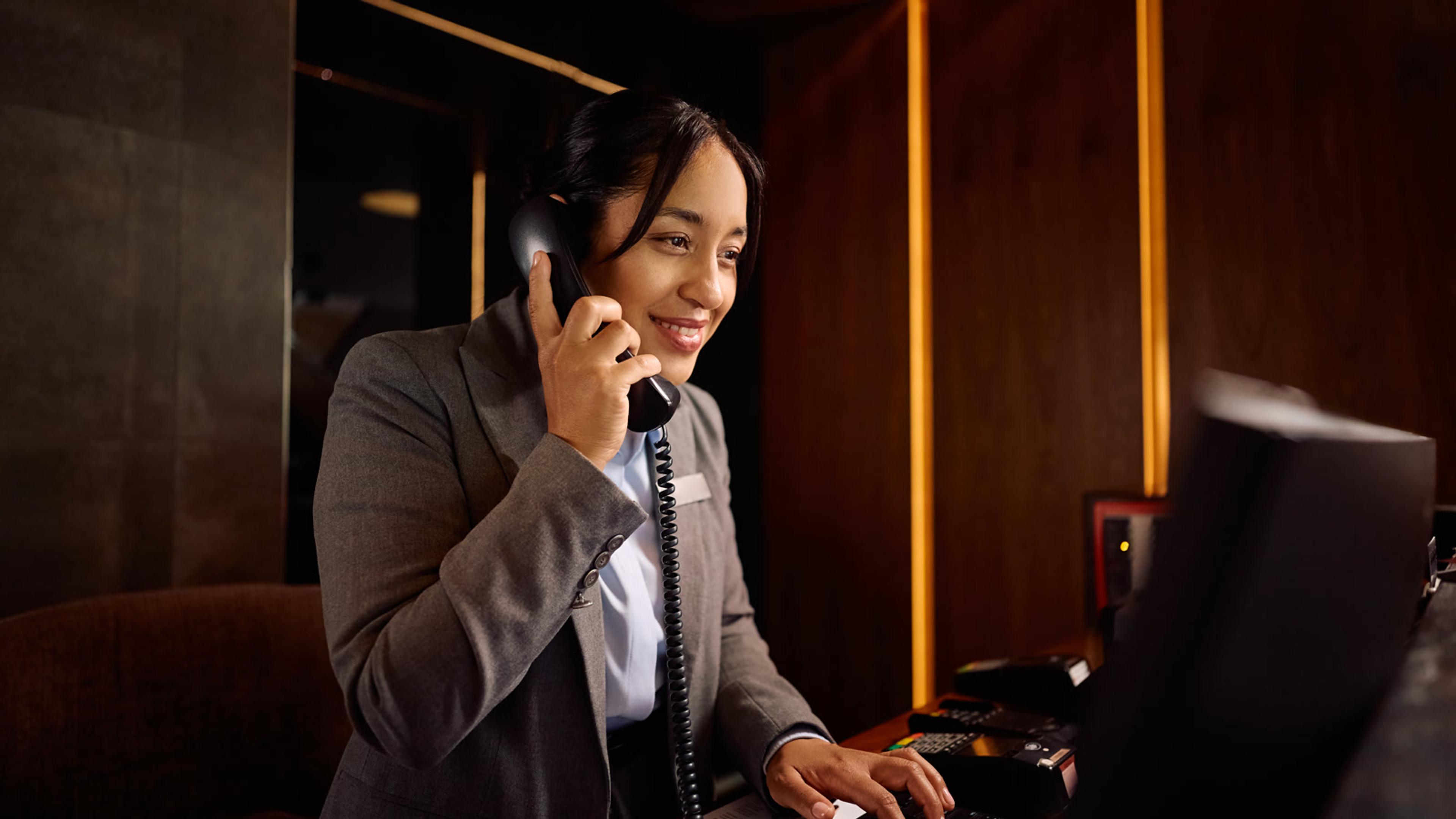 Professional covering the front desk phone during extended hours