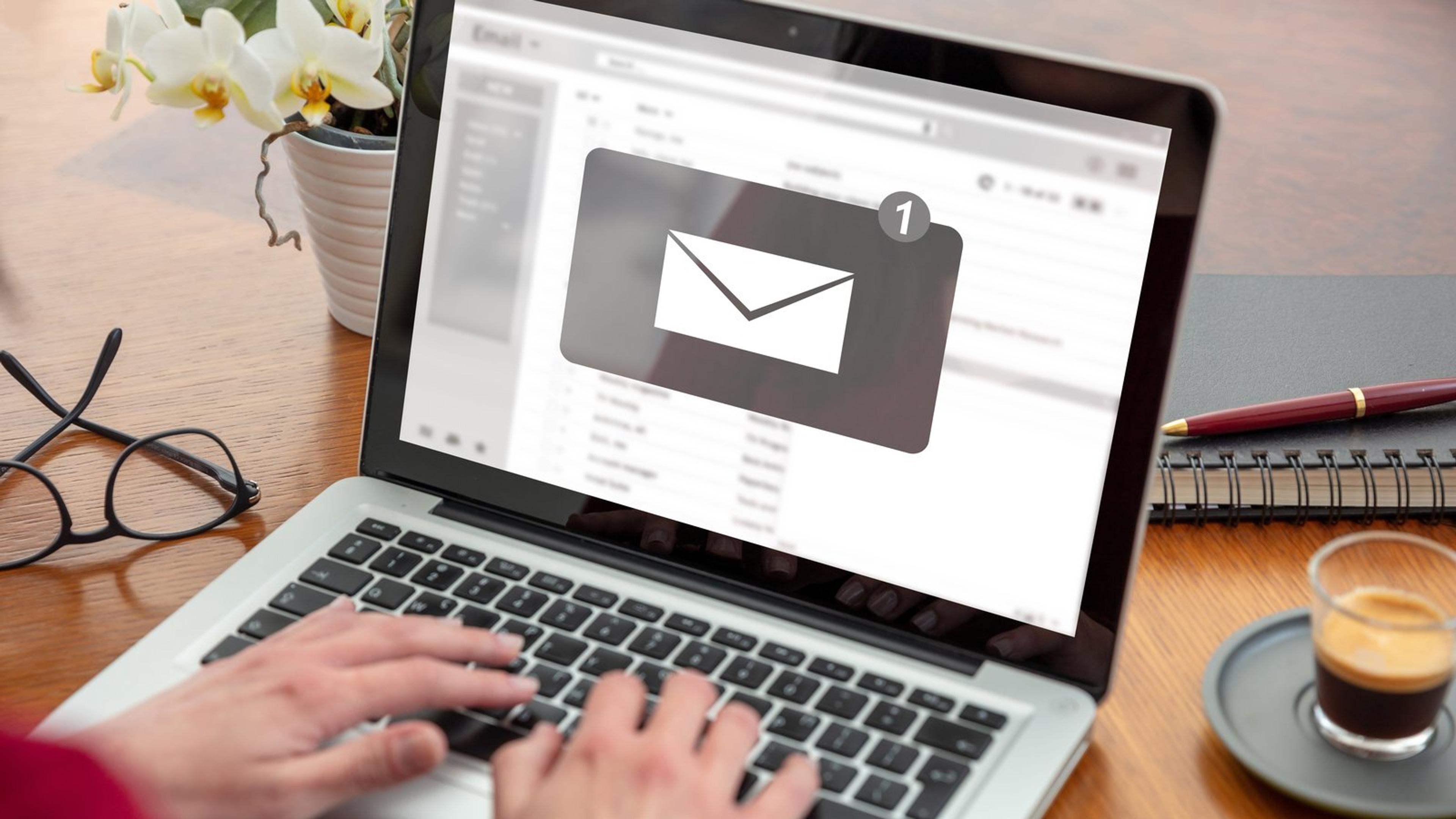 Laptop screen showing a new email notification, like a voicemail-to-email or missed-call alert