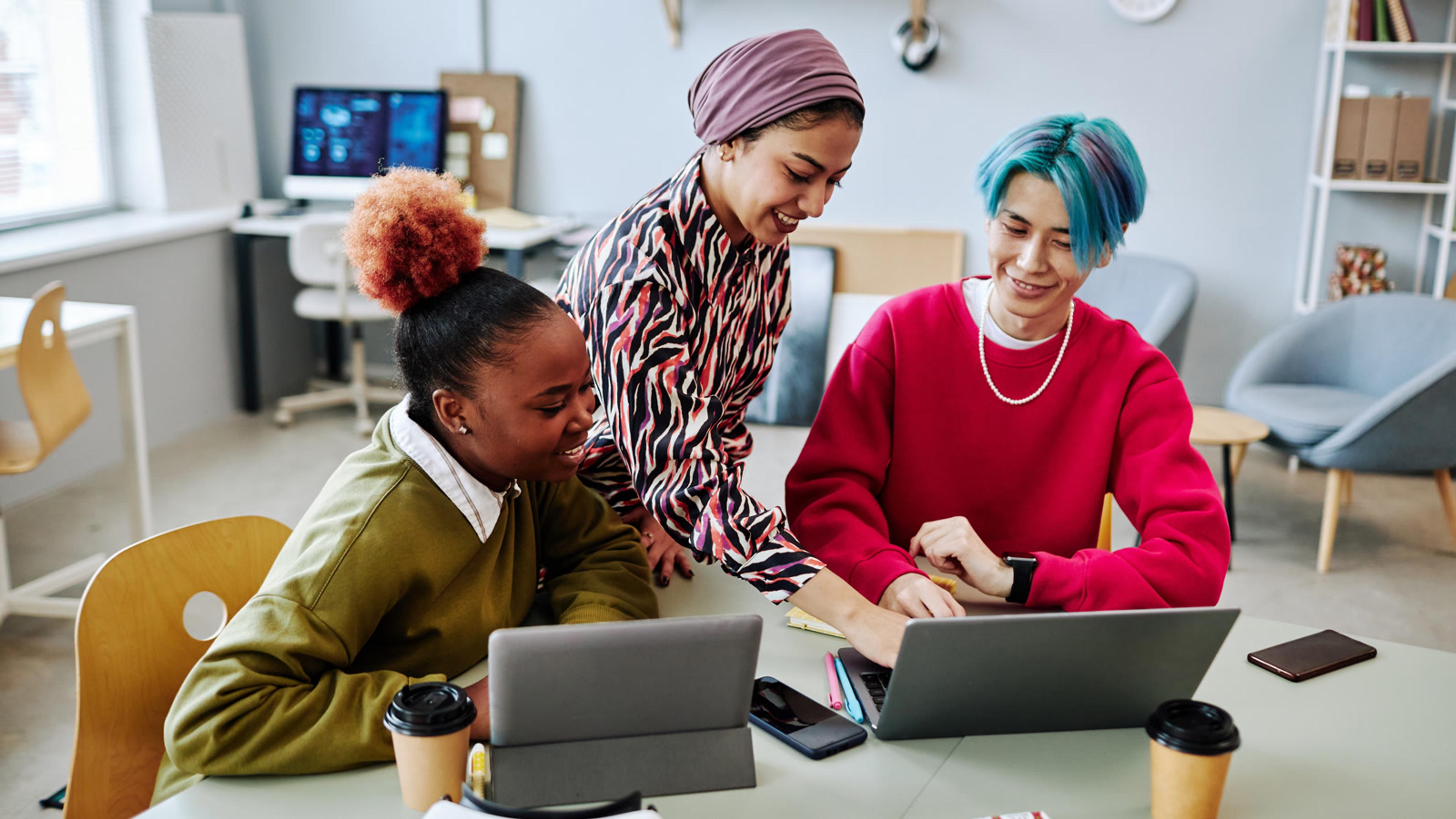 Collaborative colleagues working together in a modern office — remote team communication