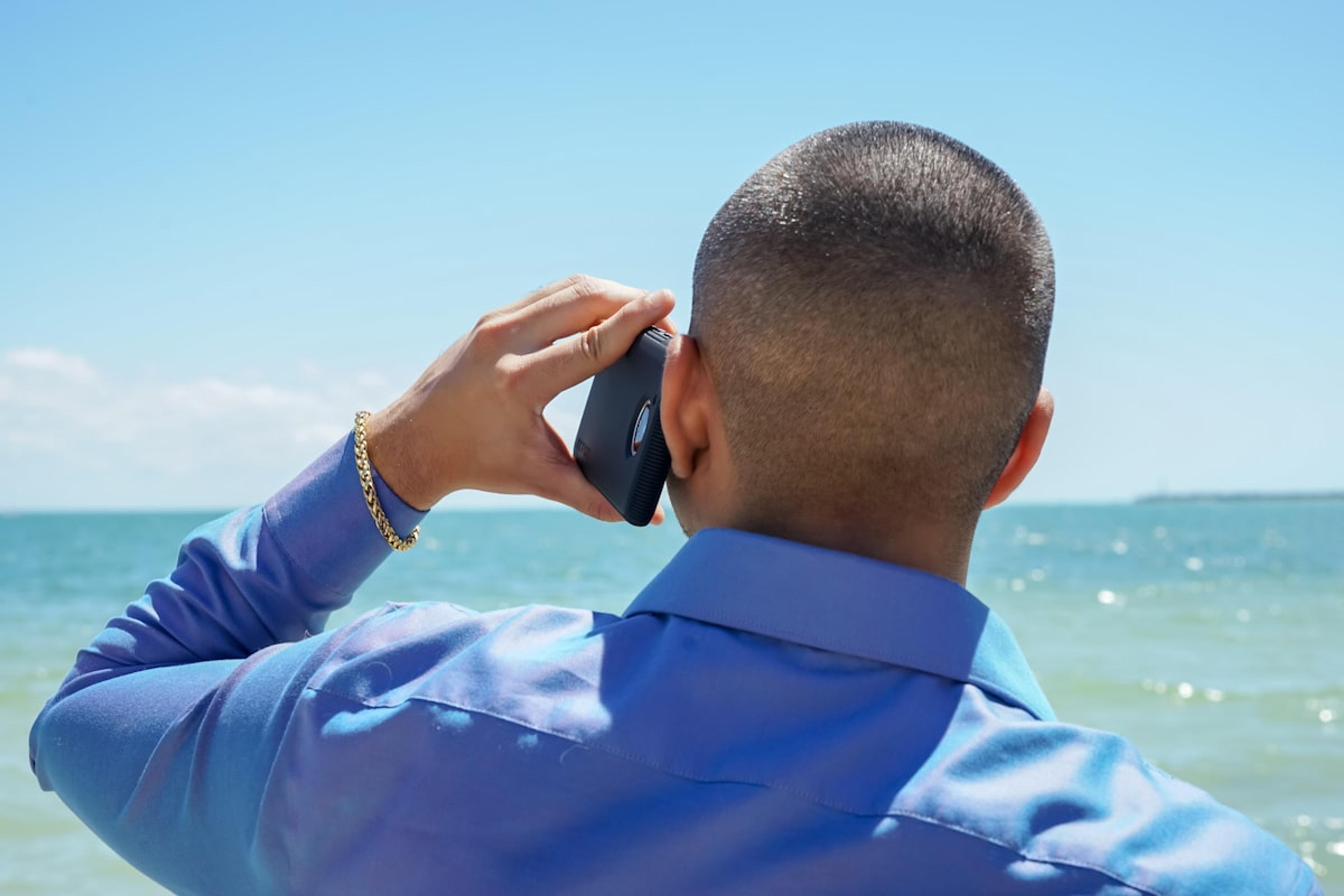 Hotel staff member using smartphone for business communications