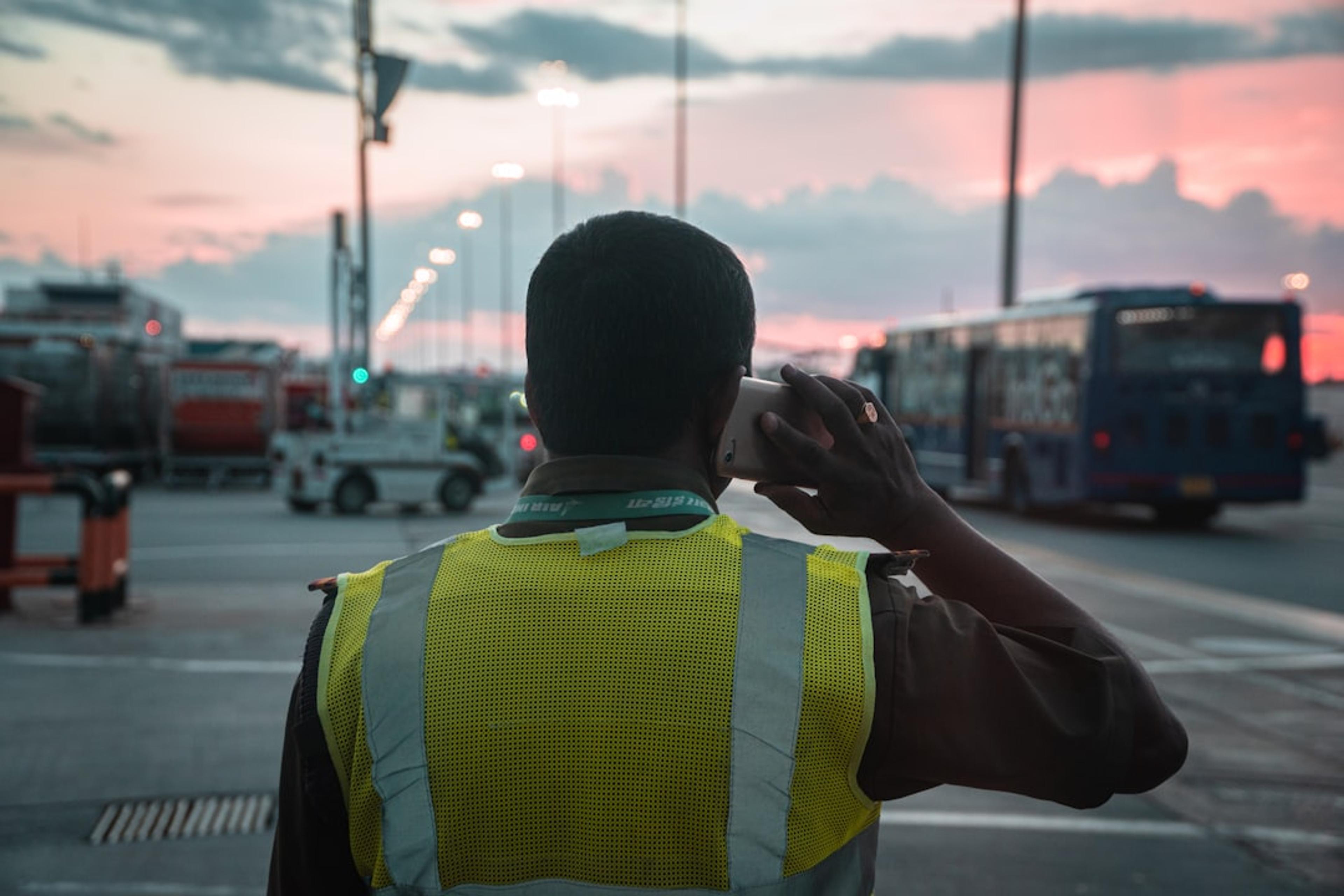 Dispatcher coordinating mobile technicians through a business phone workflow