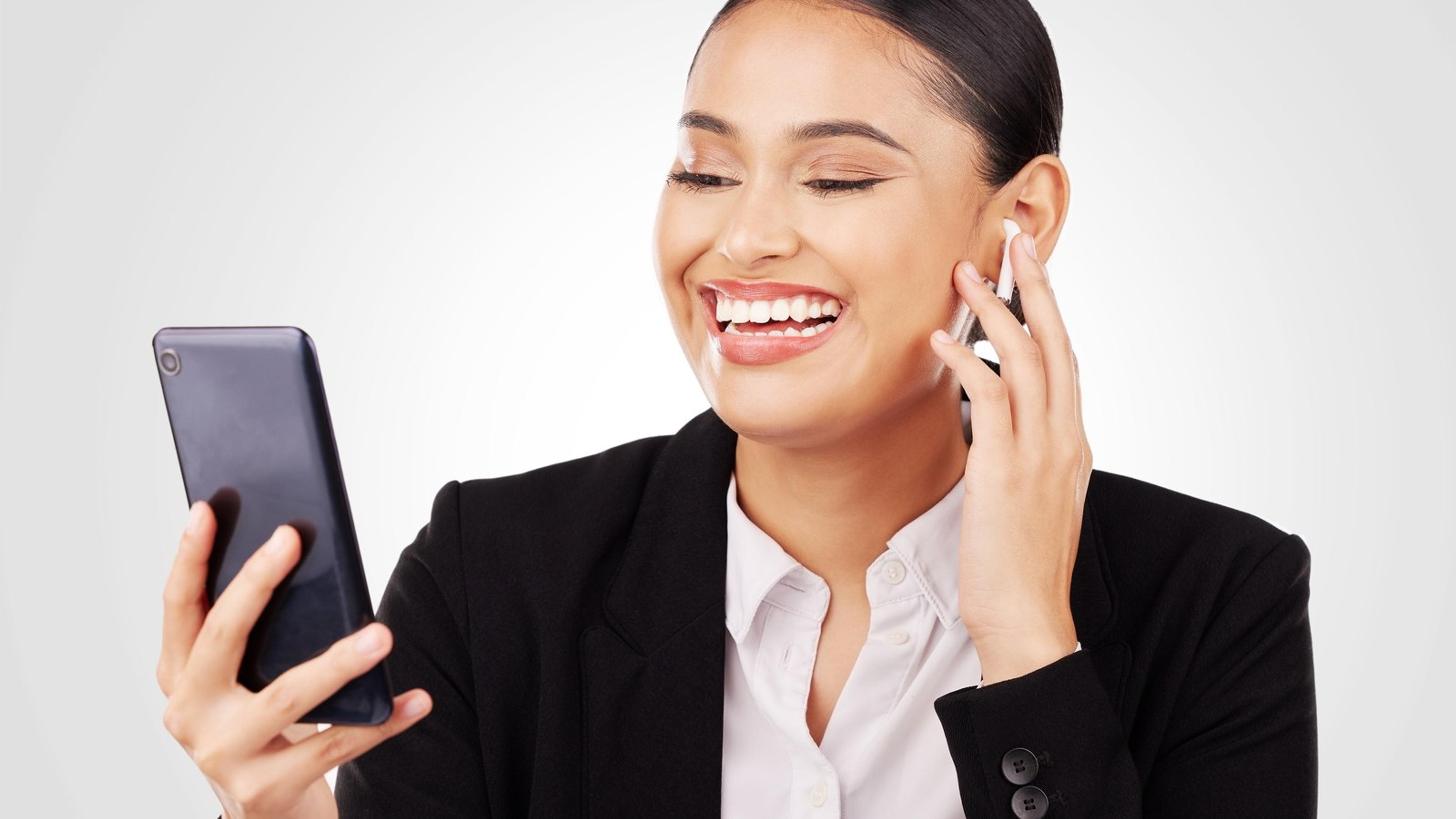 Cheerful professional video chatting on a phone — branded mobile softphone lifestyle for reseller end users