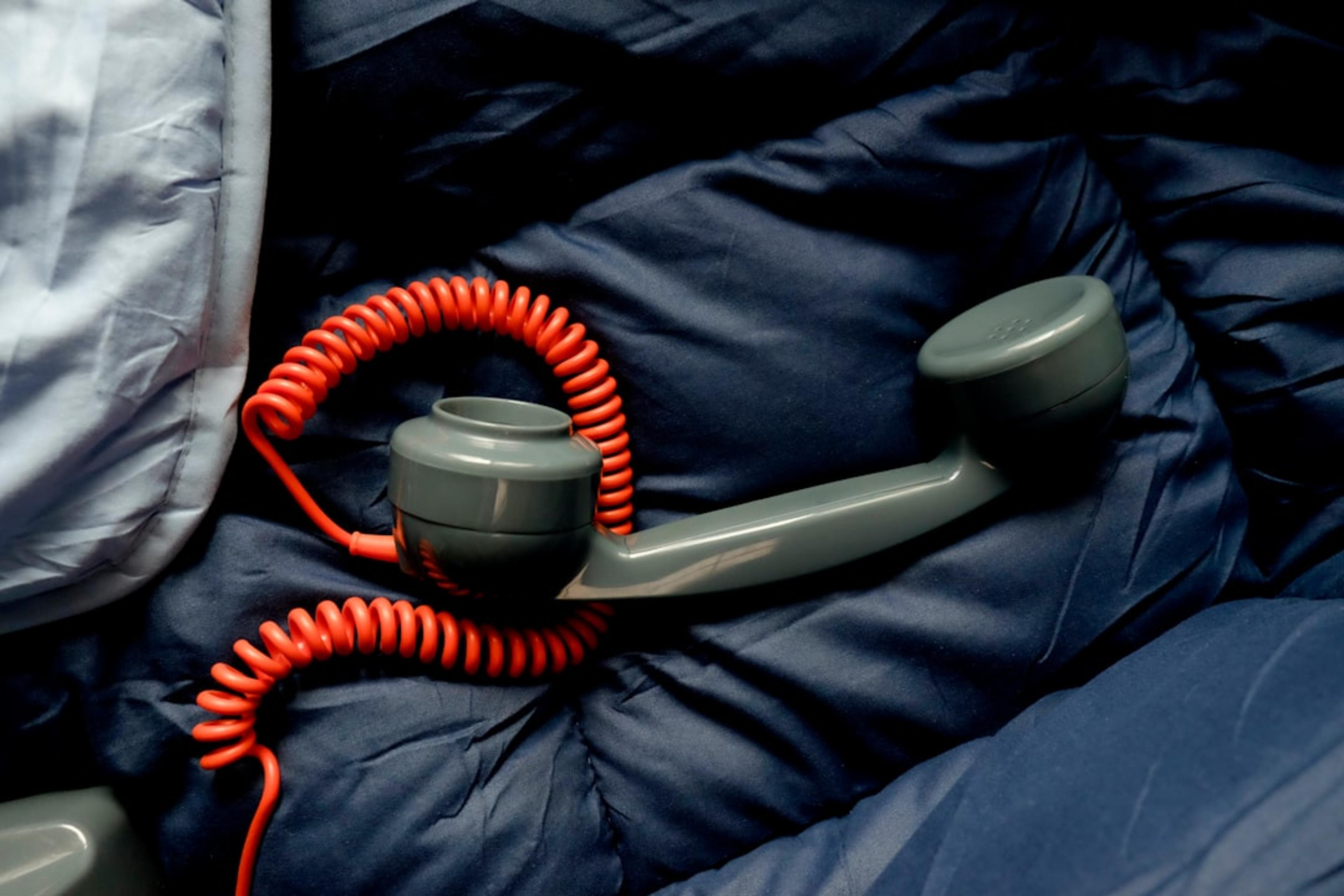 A sleeping bag with a phone hooked up to it