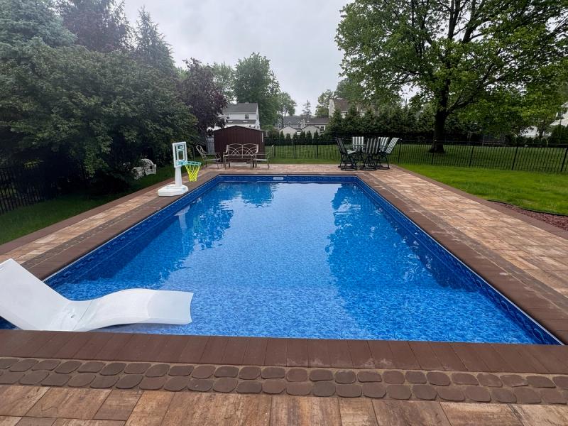 Warm-toned paver deck and tanning ledge, Clark NJ