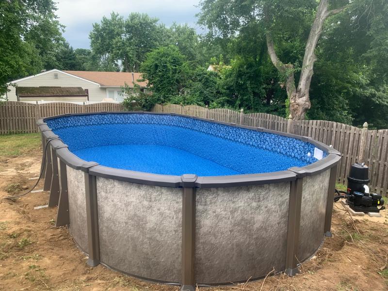 Round above ground with decorative steel walls