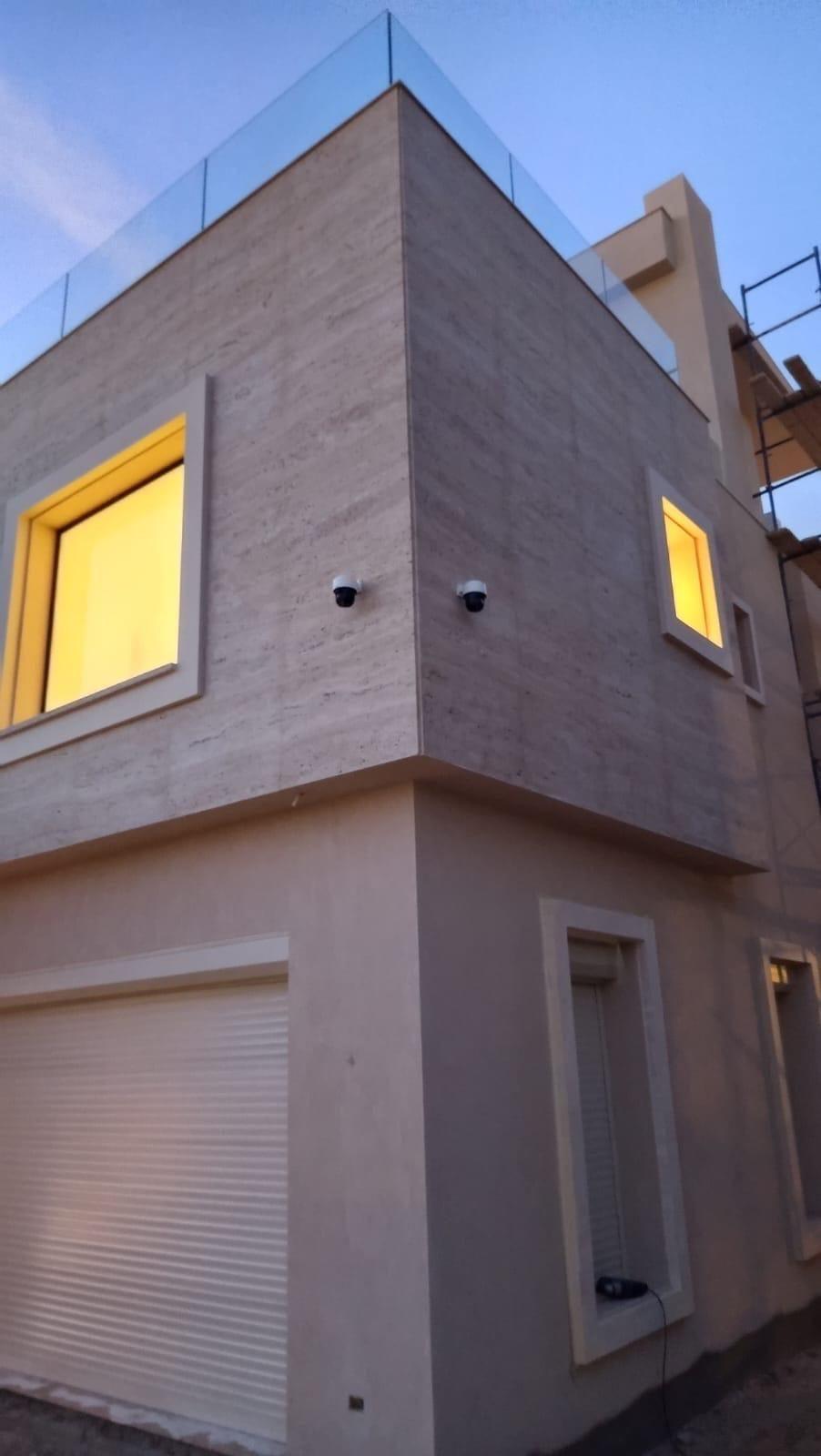 Villa in New Giza at dusk with perimeter cameras