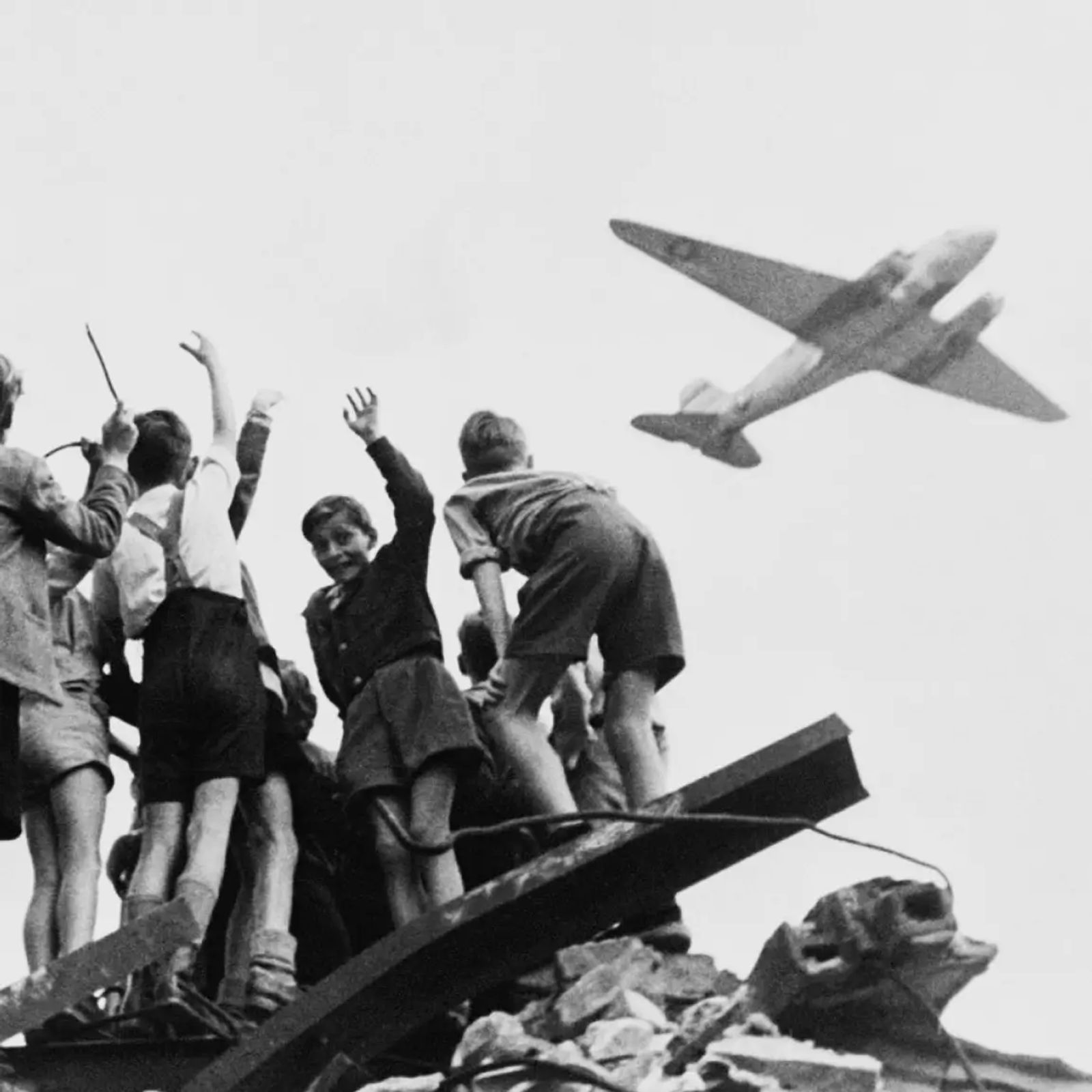 Children in Berlin waving at an Allied supply plane during the 1948 airlift