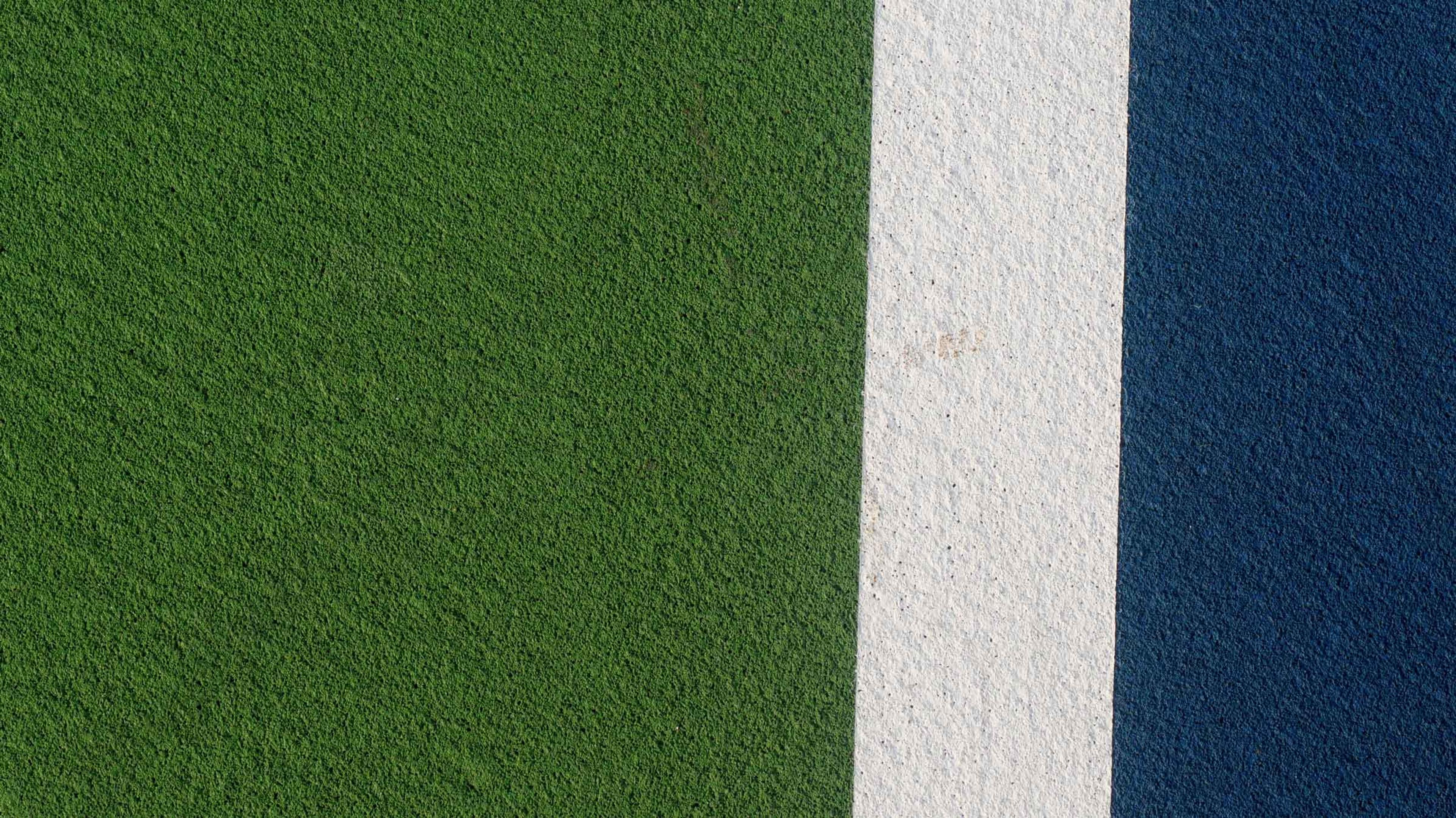 An empty tennis court, seen from above