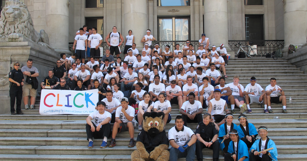 Secondary students, Vancouver Police officers and Taiko drummers fill the front steps of the Vancouver Art Gallery behind a CLICK banner