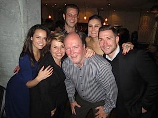 A group of guests gathered at the bar