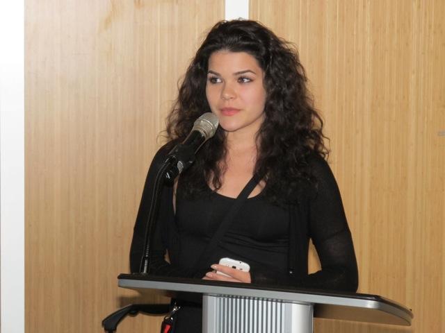 Jesse speaking at a podium at CLICK's 2015 fundraising reception