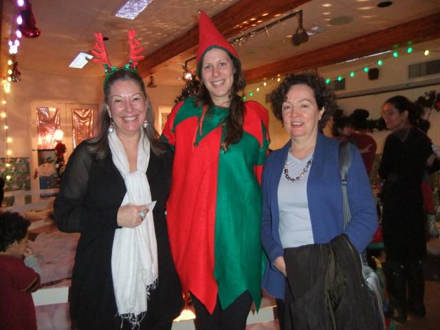 CLICK board members in elf hats among the Christmas decorations