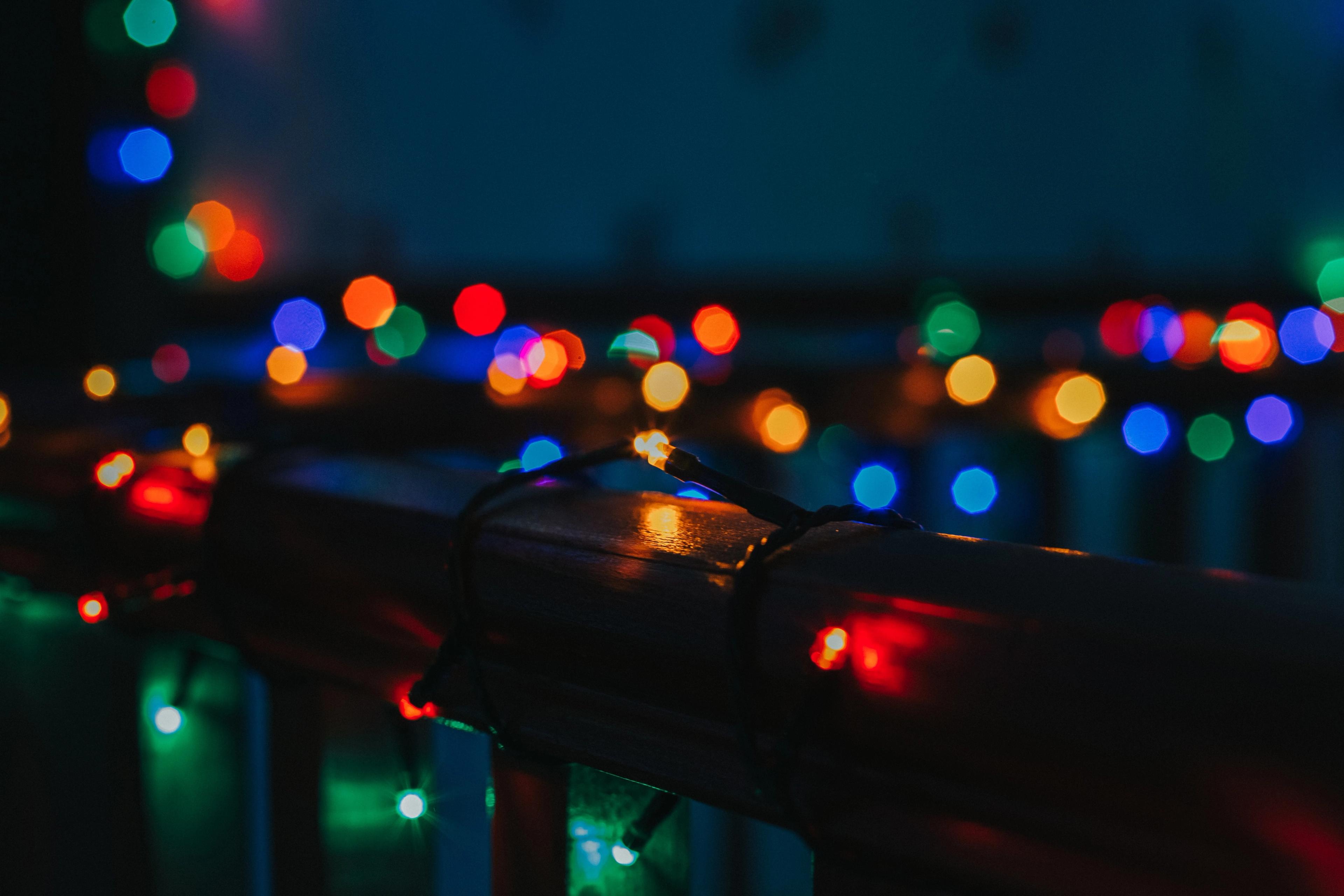 Out-of-focus string of coloured holiday lights
