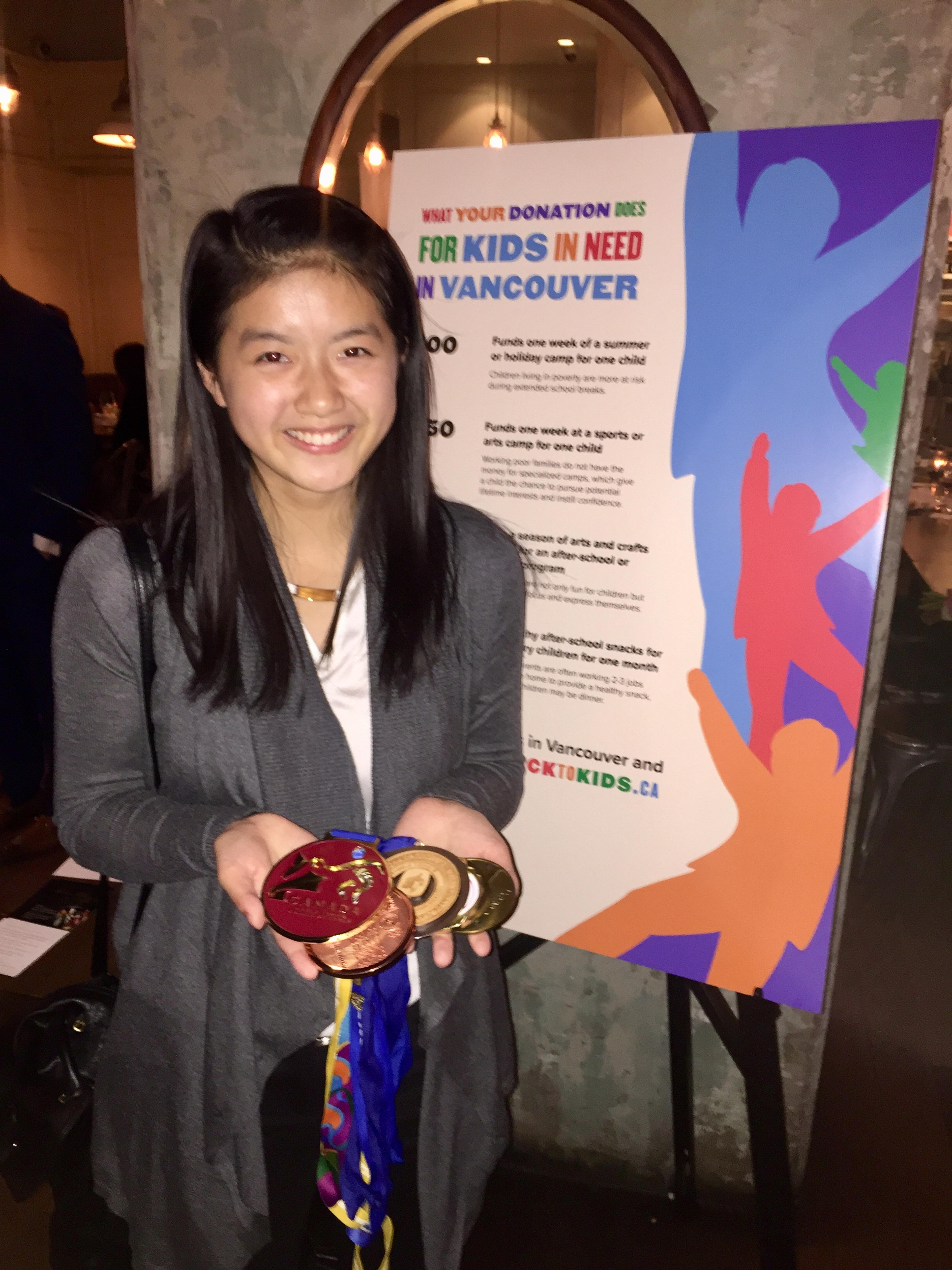 Speaker Ivy Liao beside the CLICK campaign poster at the dinner