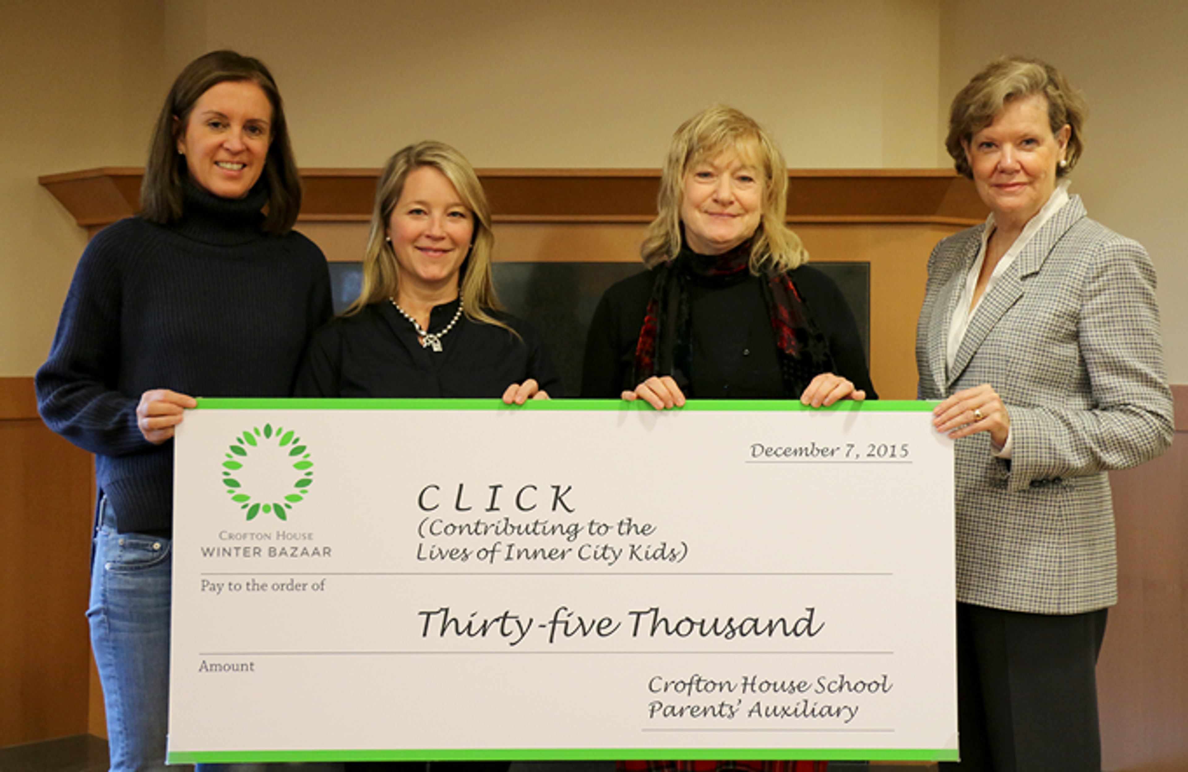 Crofton House School representatives present a $35,000 cheque to CLICK president Catherine Atyeo