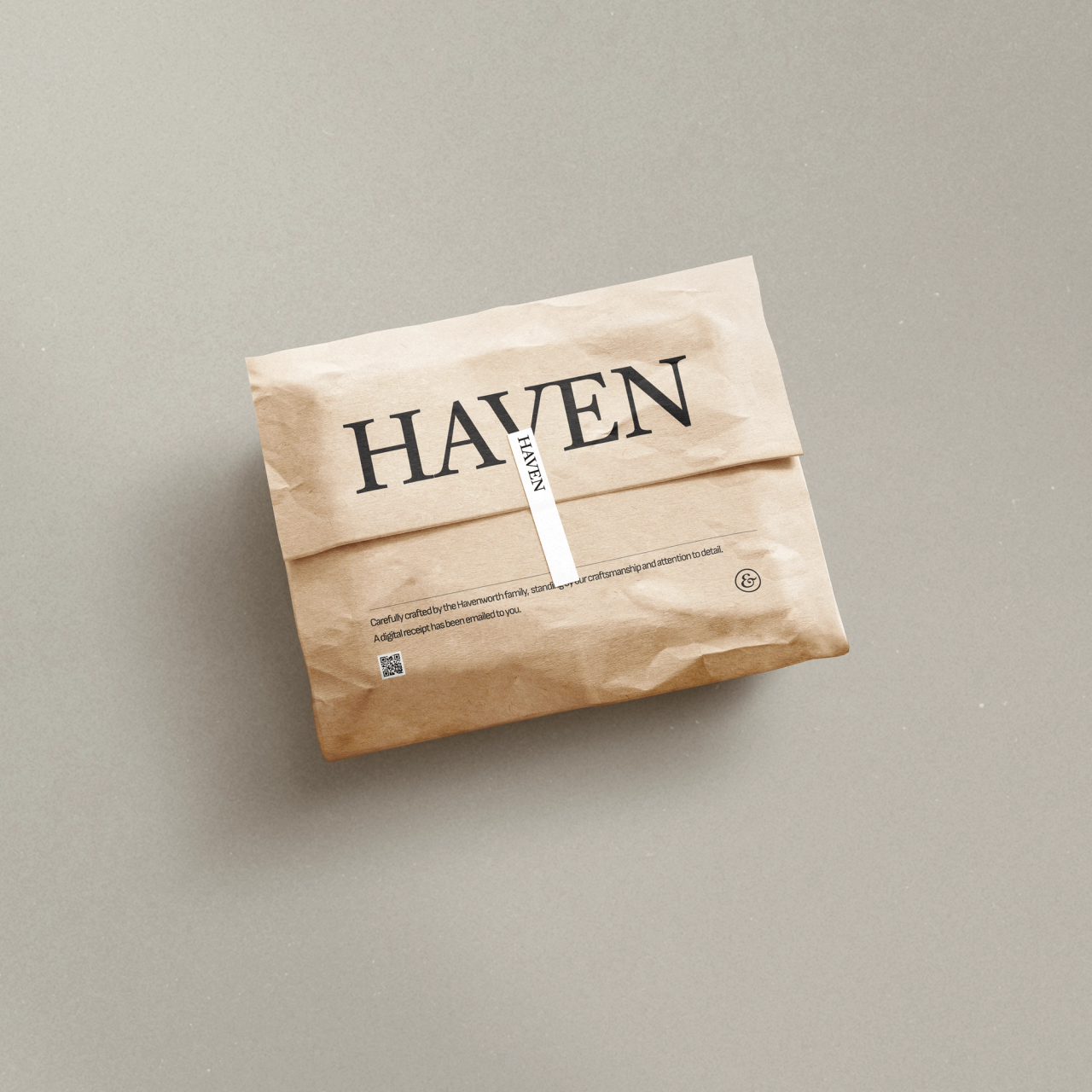A crumpled kraft parcel with the HAVEN wordmark and a white seal strip