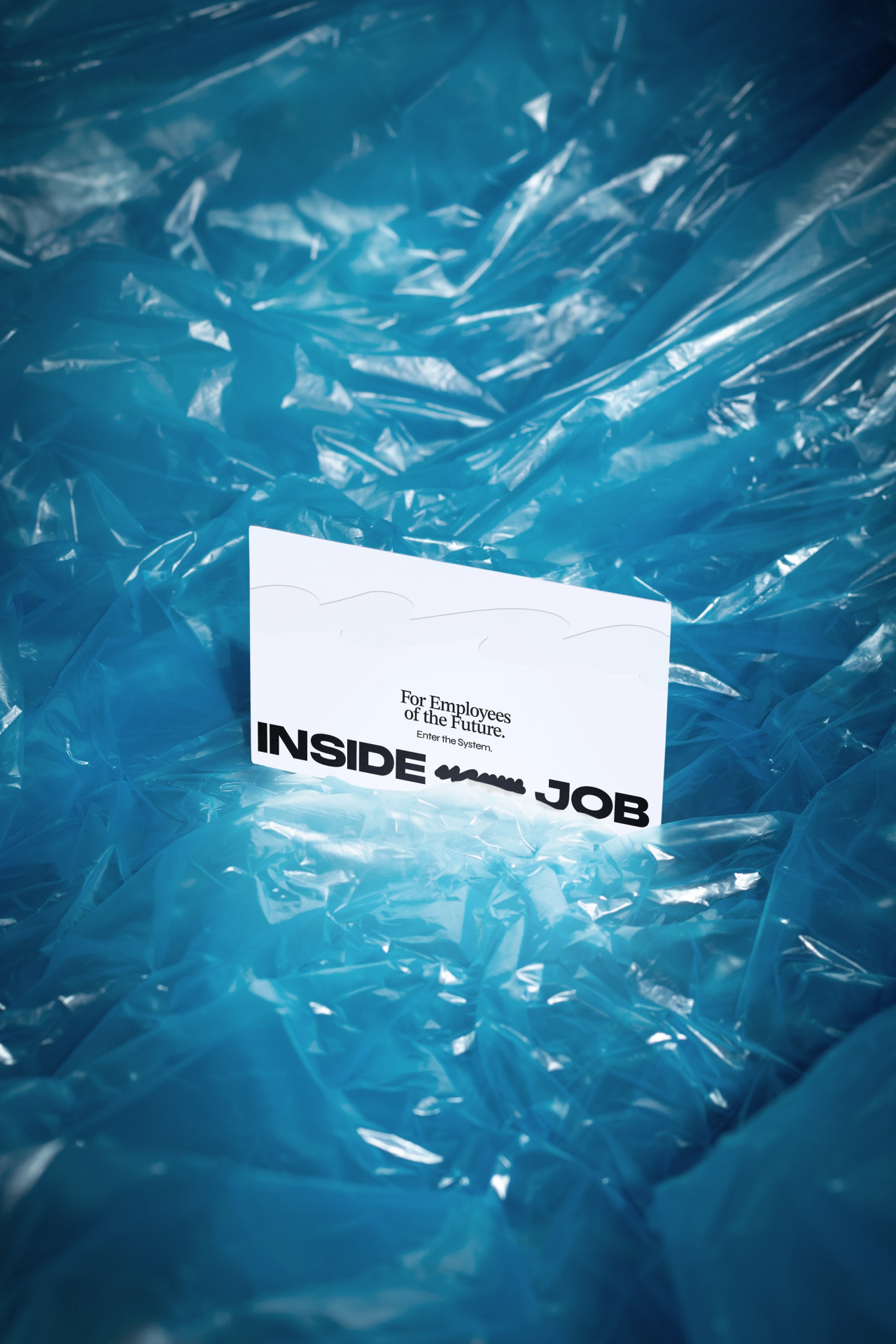 An Inside Job card reading "For Employees of the Future" in crumpled blue plastic