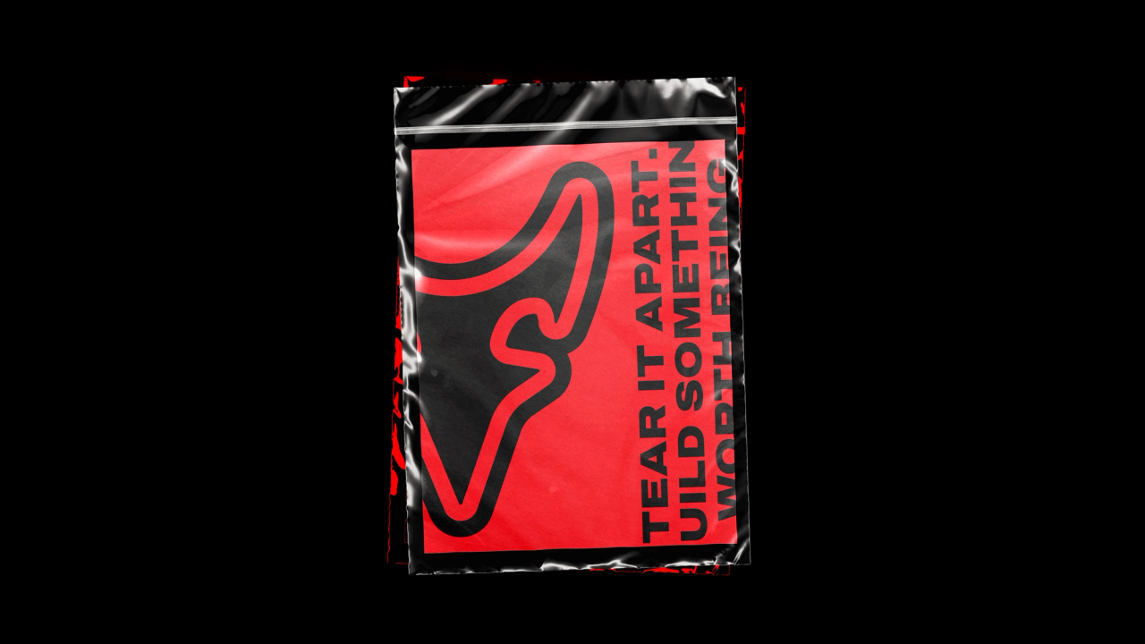 A clear plastic bag holding a red D2R card that reads "Tear it apart"