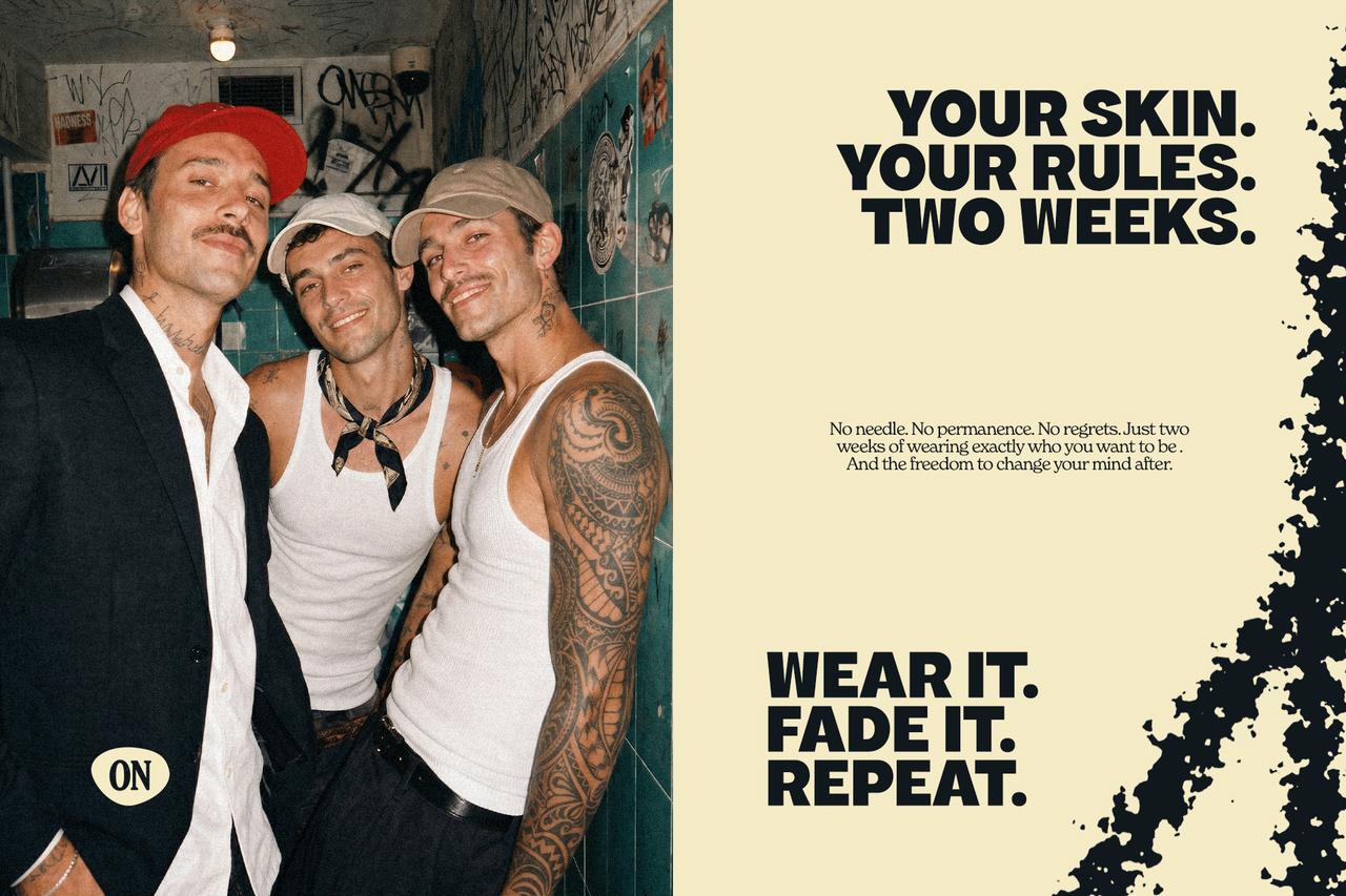 Three men in caps, one with a full tattoo sleeve, beside a cream INKON panel