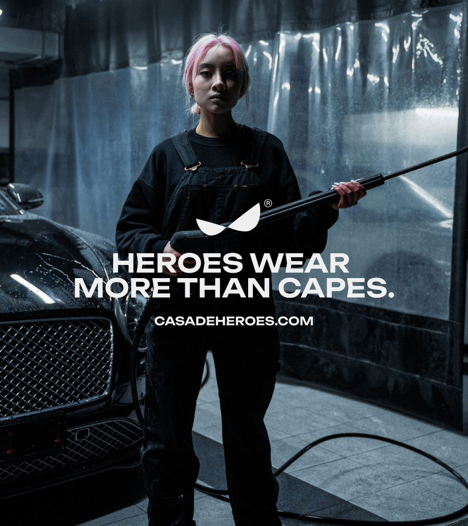 A pink-haired woman with a pressure washer, overlaid with "Heroes wear more than capes" and casadeheroes.com