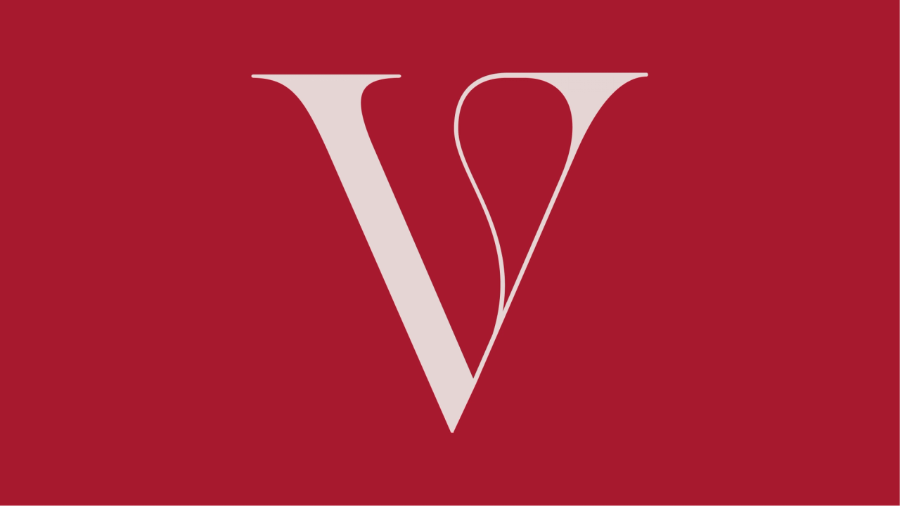 V monogram in pale pink on a deep red field