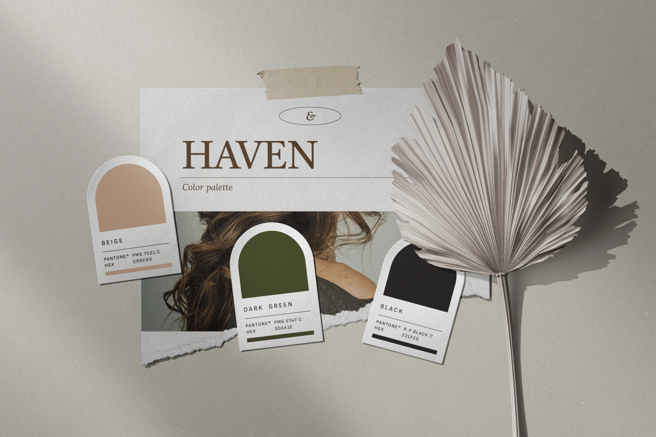 HAVEN palette swatches in beige, dark green and black beside a dried palm leaf