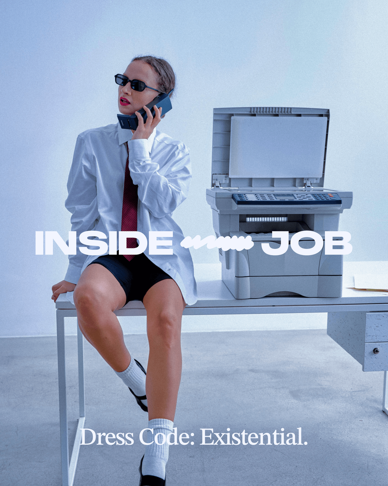 A model on an office desk beside a photocopier