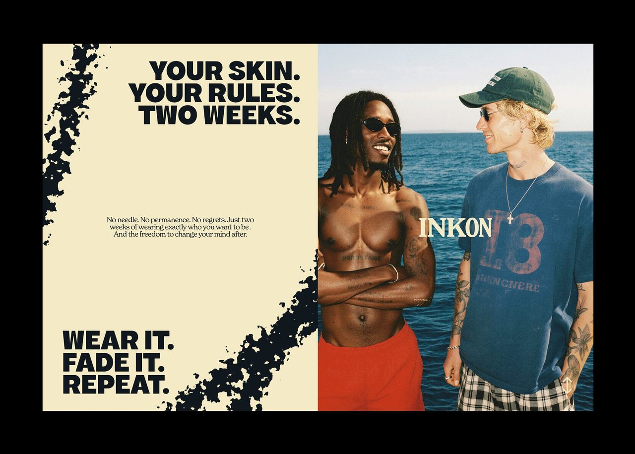 Two men by the sea beside an INKON panel reading "Wear it. Fade it. Repeat"