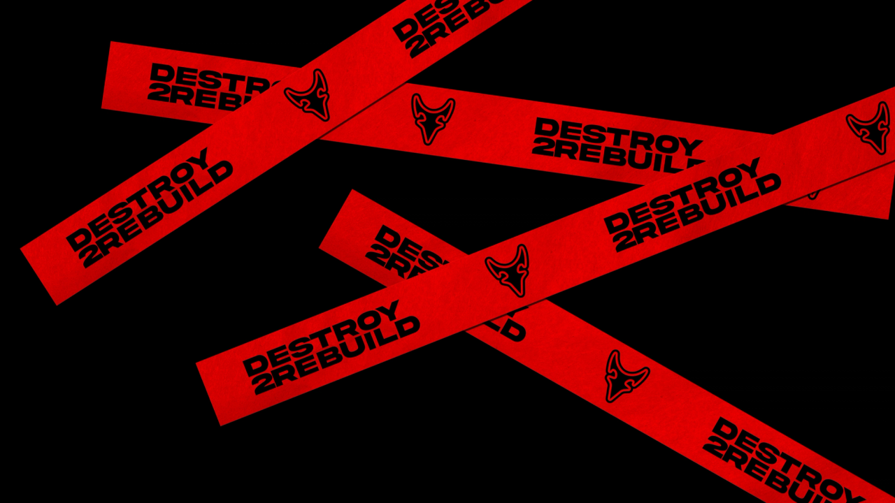 Crisscrossed strips of red Destroy 2 Rebuild tape with horned logos on black