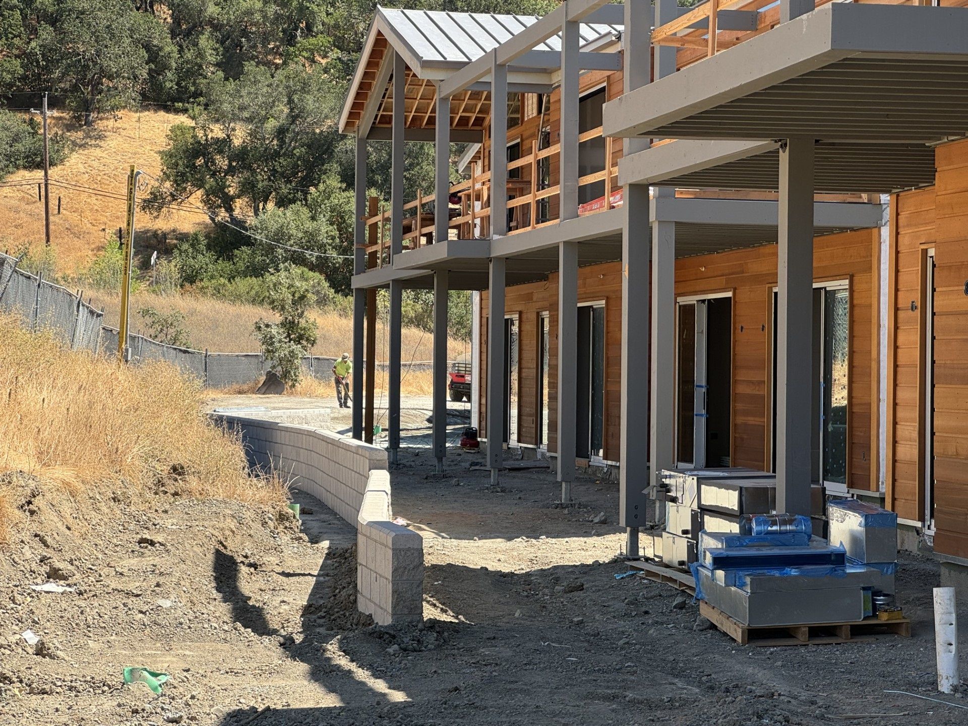 Retaining wall installation and exterior framing & finish work in progress