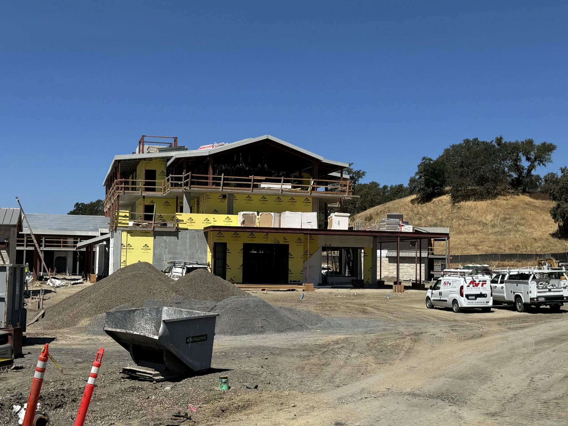 Main building siding and exterior finishes are in progress