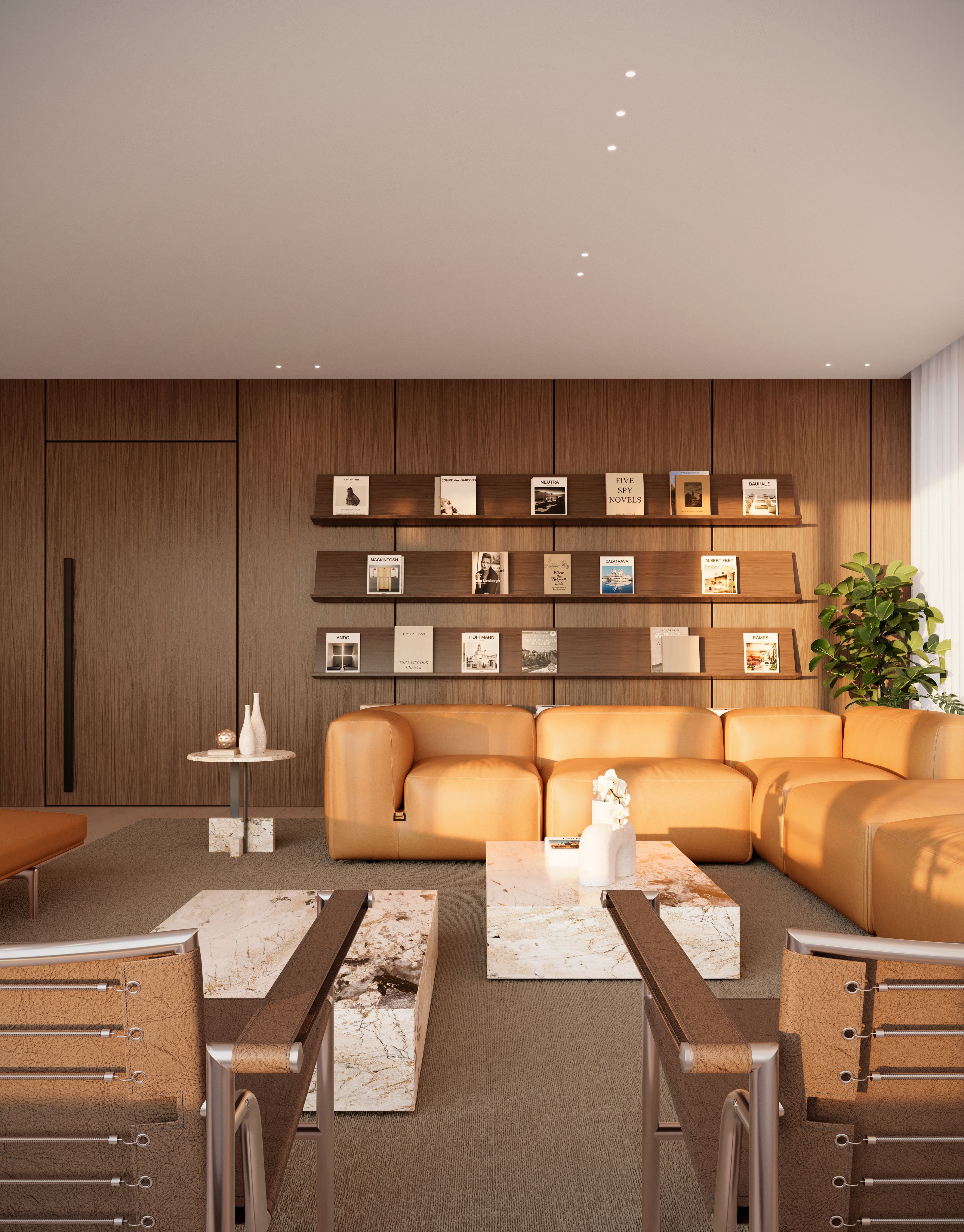 Render de un lounge para residentes con sofás de cuero color camel frente a una estantería iluminada con libros y objetos