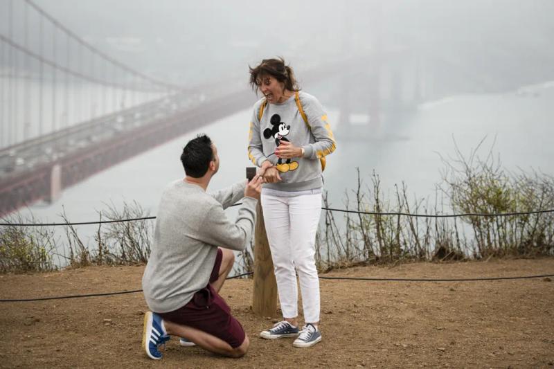 Rich proposing to Catherine at a clifftop overlook