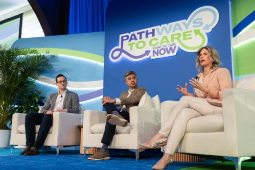 Recommended ALT text: Three individuals speaking on stage at POCMA's 2026 POC Now Summit in New York City