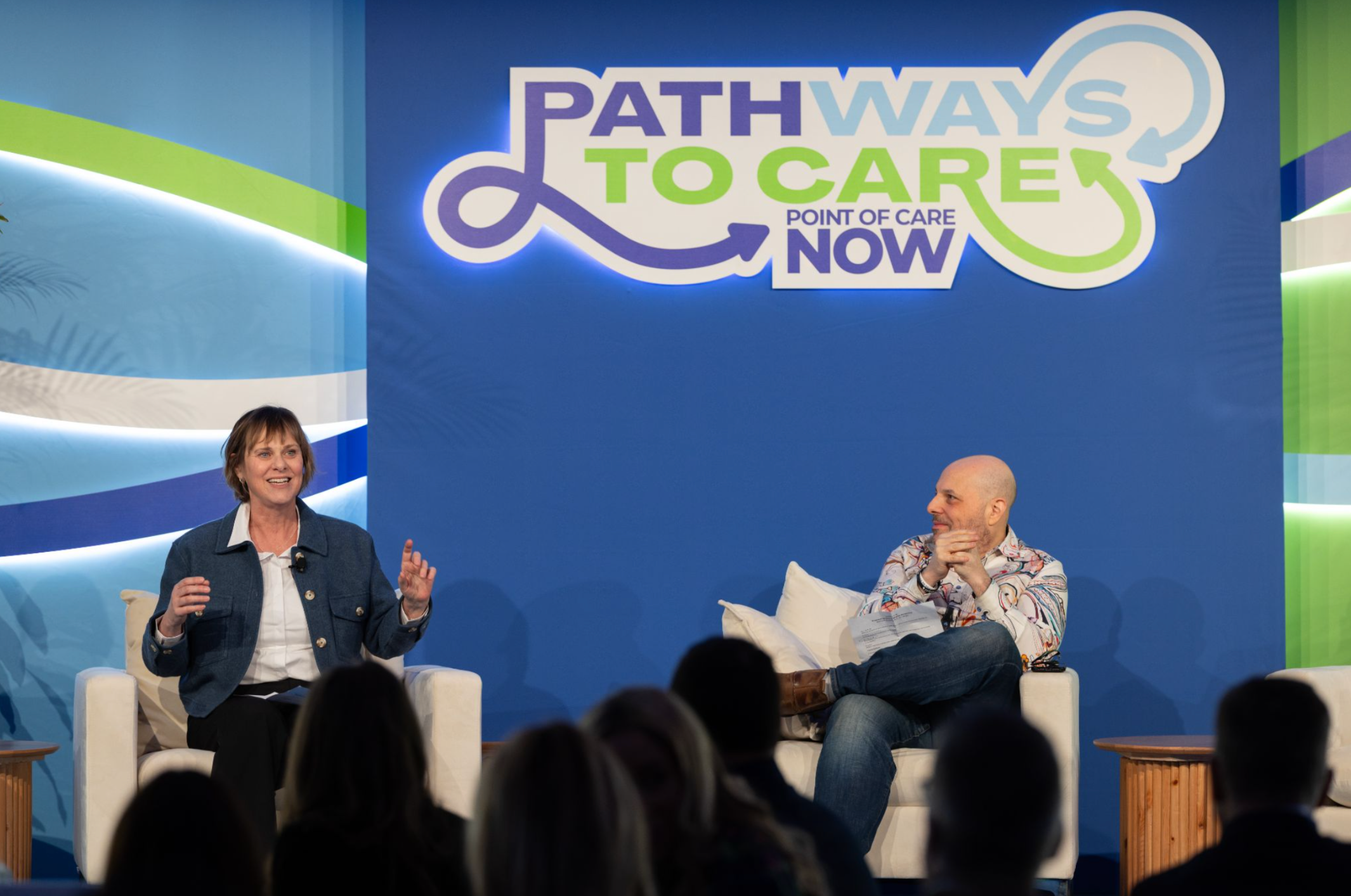 Jen Singer and Matthew Zachary address attendees at the 2026 POC Now Summit at Pier Sixty in New York City