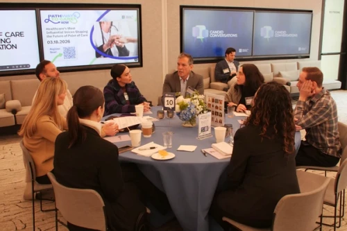 Attendees at POCMA's January Candid Conversations event sitting at a round table.