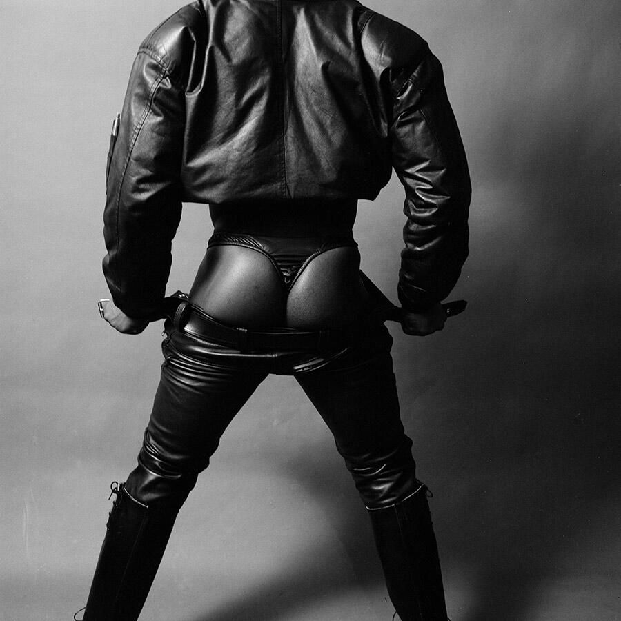 photo from behind of a man with his trousers down