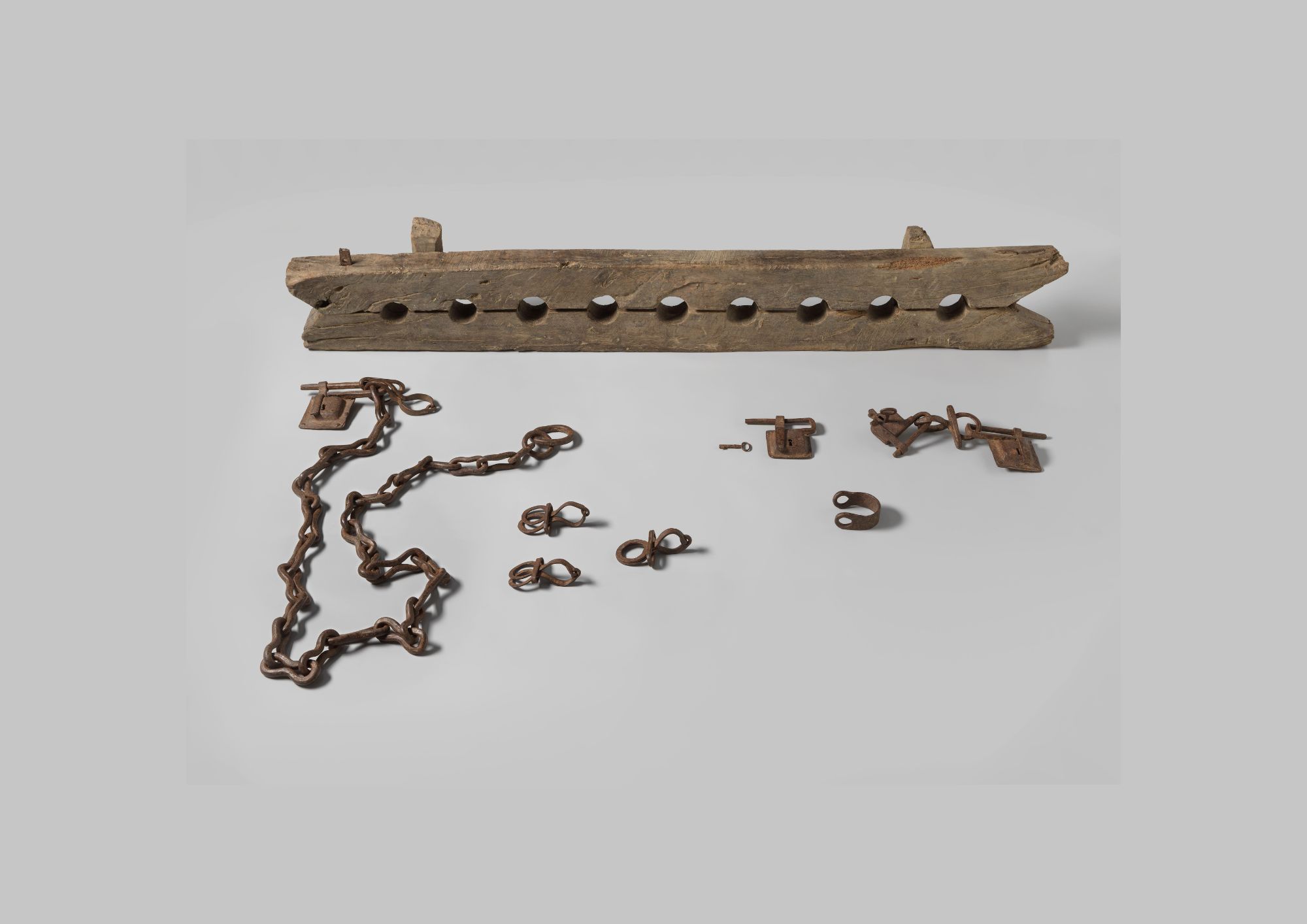 wooden ankle shackle with metal chains